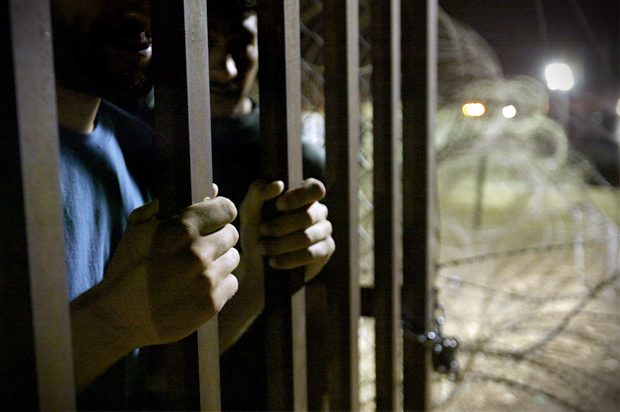 A detainee in the Abu Ghraib Prison on the outskirts of Baghdad, Iraq, May 10, 2004. (AP/John Moore)