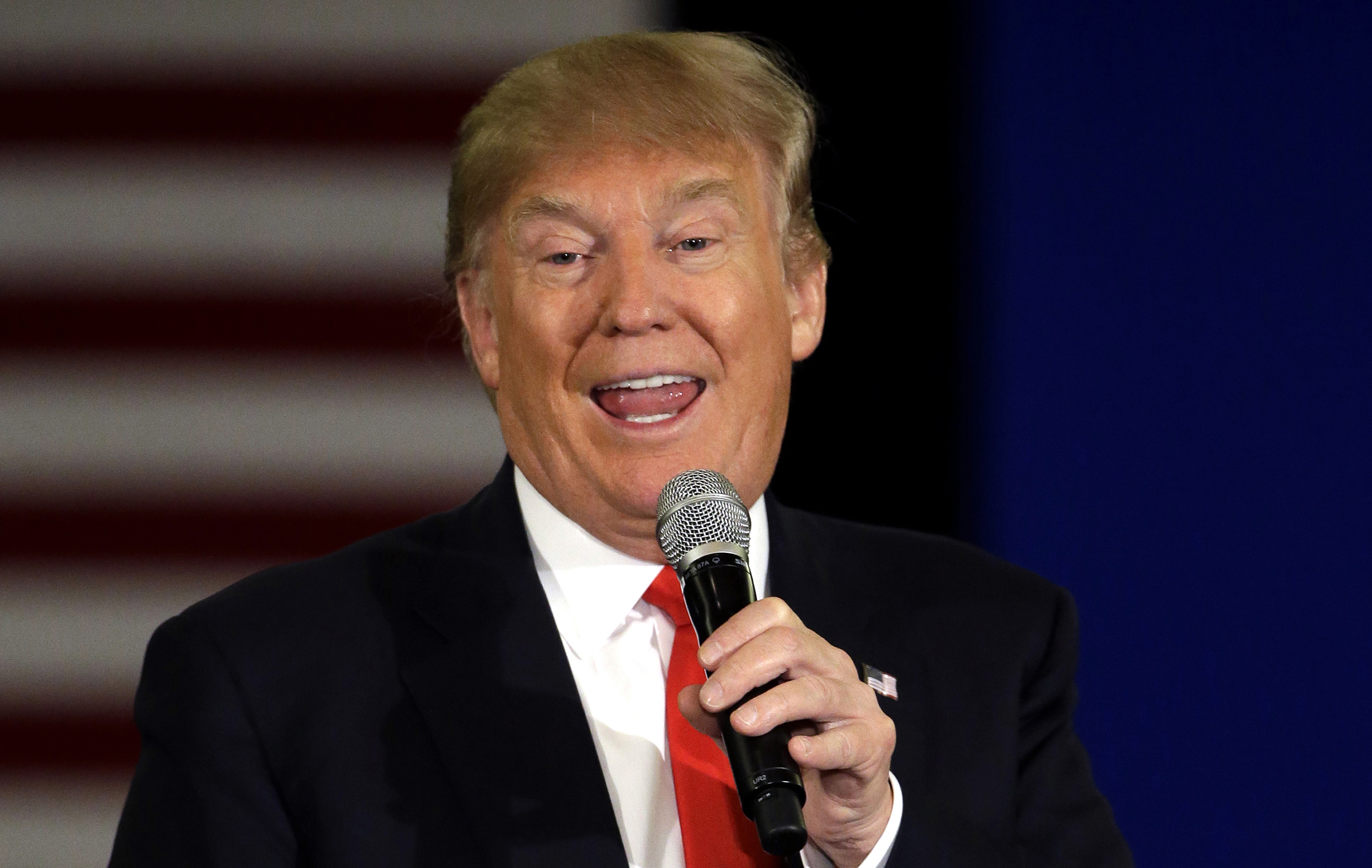 In this March 30, 2016, file photo, Republican presidential candidate Donald Trump speaks at a campaign stop in Appleton, Wis. A new Associated Press-GfK poll finds that Americans trust Democratic presidential front-runner Hillary Clinton more than Republican leader Trump to handle a wide range of issues, from immigration to health care to nominating Supreme Court justices.  (AP Photo/) (AP/Nam Y. Huh, File)