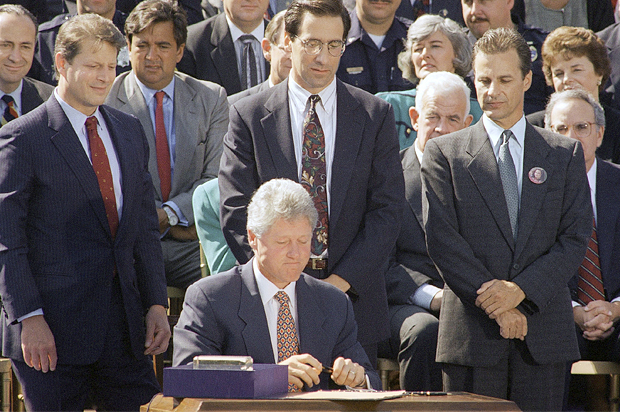 Bill Clinton signs the $30 billion crime bill, Sept. 13, 1994. (AP/Dennis Cook)