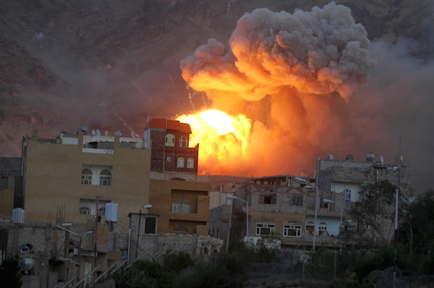 Fire and smoke billows from an army weapons depot after it was hit by an air strike in Yemen's capital Sanaa on May 11, 2015 (Reuters/Mohamed al-Sayaghi)