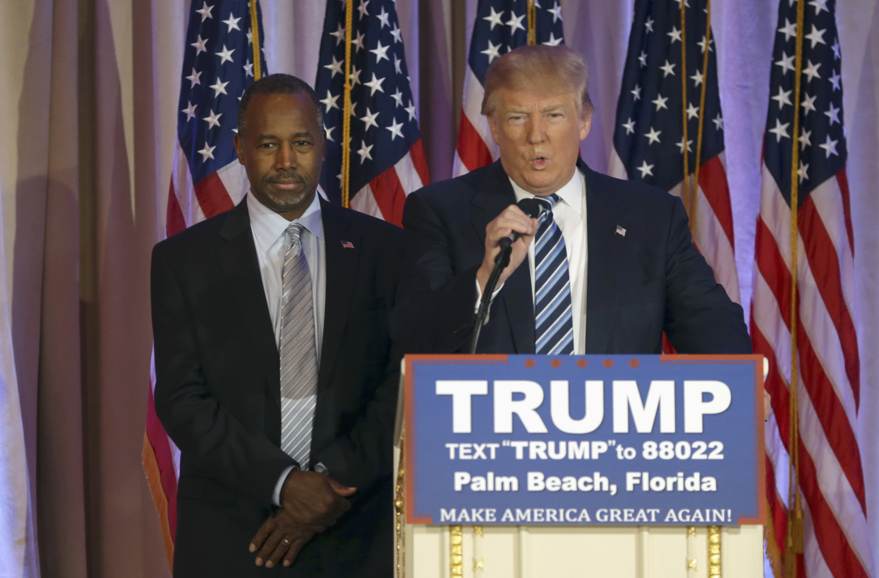 FILE - In this March 11, 2016 file photo, former Republican presidential candidate Ben Carson listens at left, before announcing he will endorse Republican presidential candidate Donald Trump during a news conference in Palm Beach, Fla.  But rarely have so many partnerships of political necessity appeared to be as reluctant, awkward, even downright tortured as in the 2016 GOP race.  (AP Photo/Lynne Sladky, File) (AP)