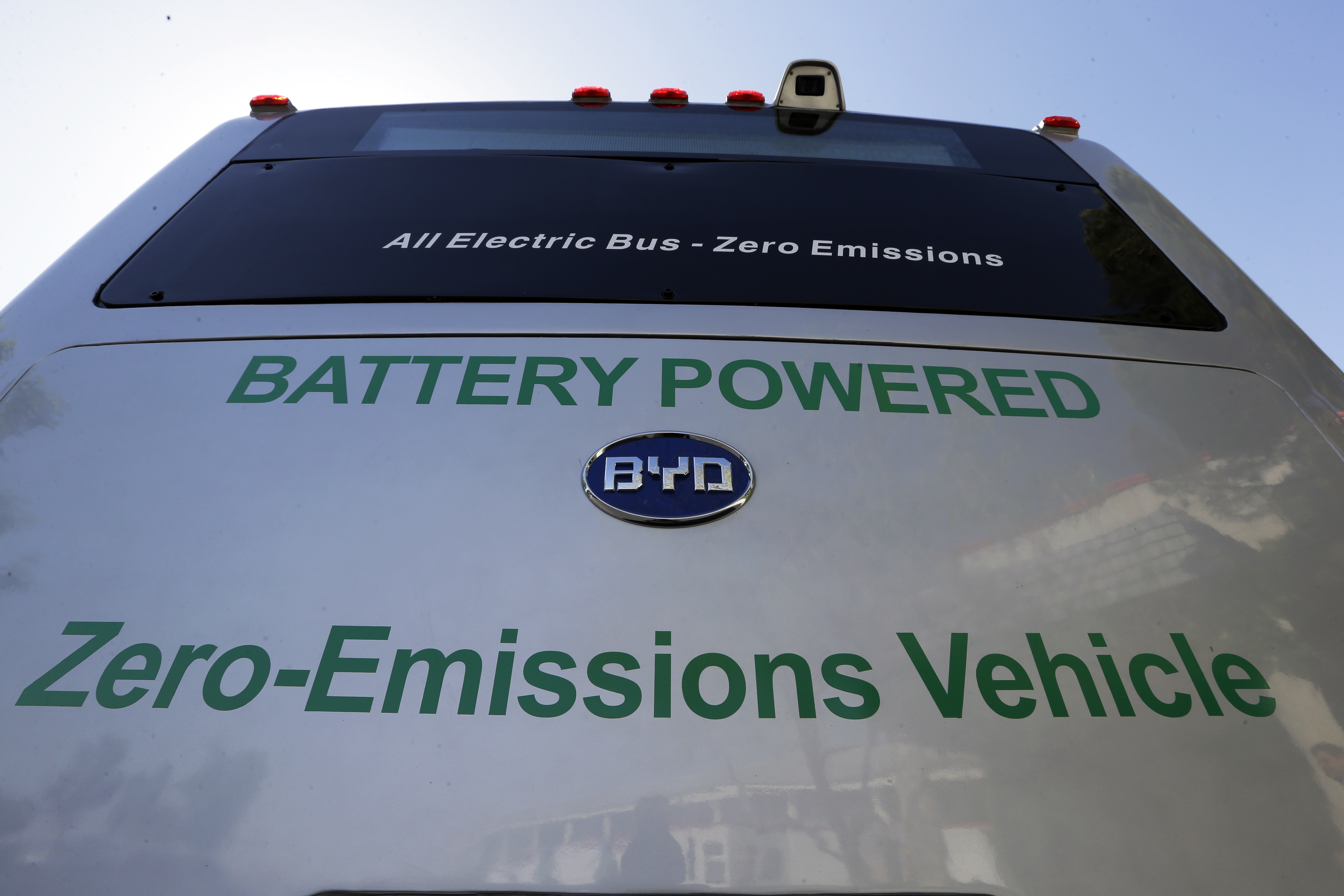 FILE - In this May 1, 2013, file photo, an electric bus produced by China's BYD Co., is parked at the announcement of the opening of an electric bus manufacturing plant in Lancaster, Calif. The Chinese automaker that sold more electric cars last year than Tesla, Nissan and GM combined is taking a back road into the American market on a battery-powered bus. (AP Photo/Reed Saxon, File) (AP)