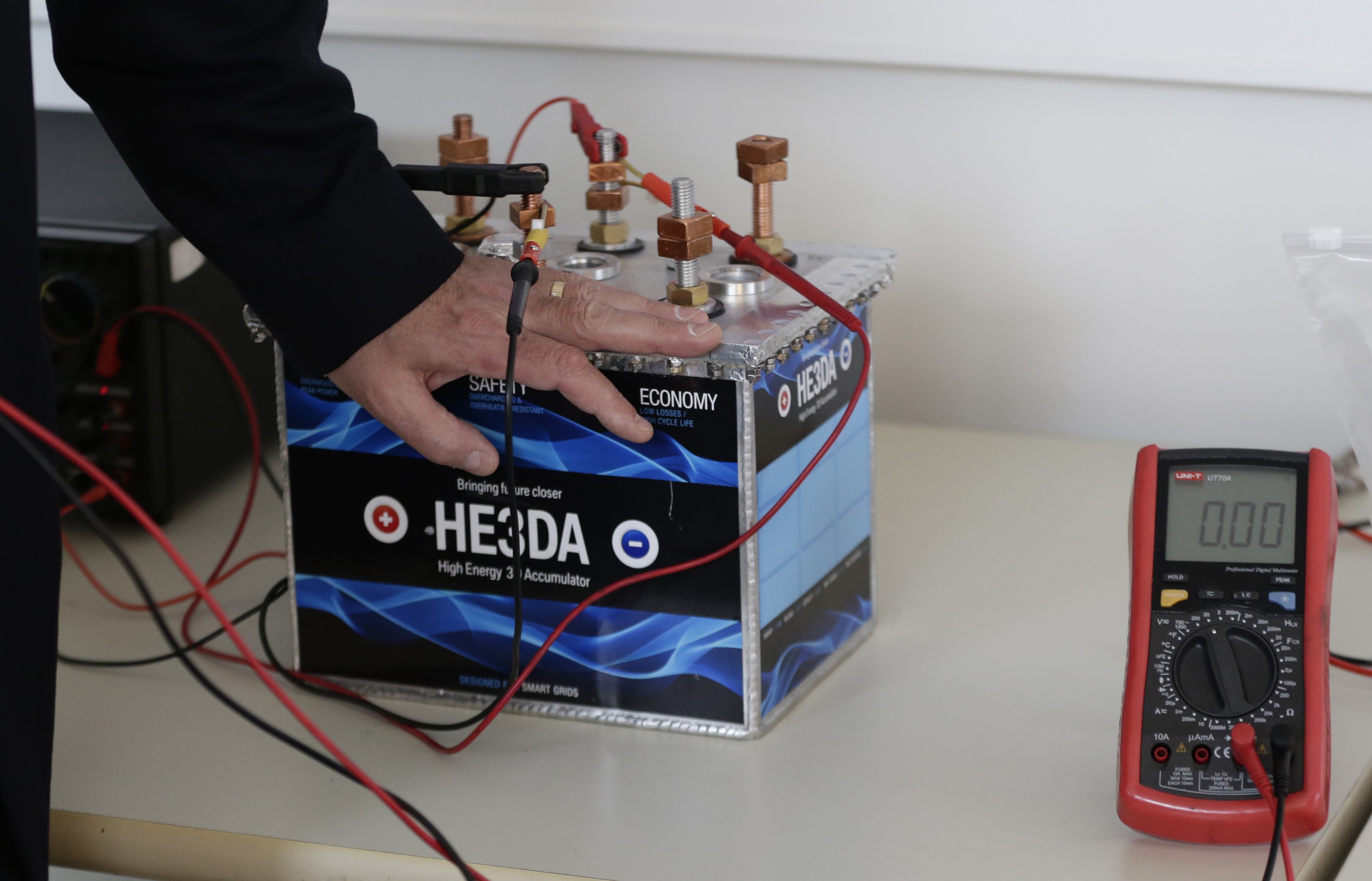 In this picture taken on Wednesday, March 9, 2016, Jan Prochazka, the president of Prague based He3Da company, presents his battery in Prague, Czech Republic. In the global race to create more efficient and long-lasting batteries, some are betting on nanotechnology - the use of minuscule parts - as the most likely to yield a breakthrough. Improving batteries performance is key to the development and success of many much-hyped technologies, from solar and wind energy to electric cars. Research into how to achieve that has followed several avenues, from using different materials than the existing lithium-ion batteries to changing the internal structure of batteries using nanoparticles - parts so small they are invisible to the naked eye. (AP Photo/Petr David Josek) (AP)