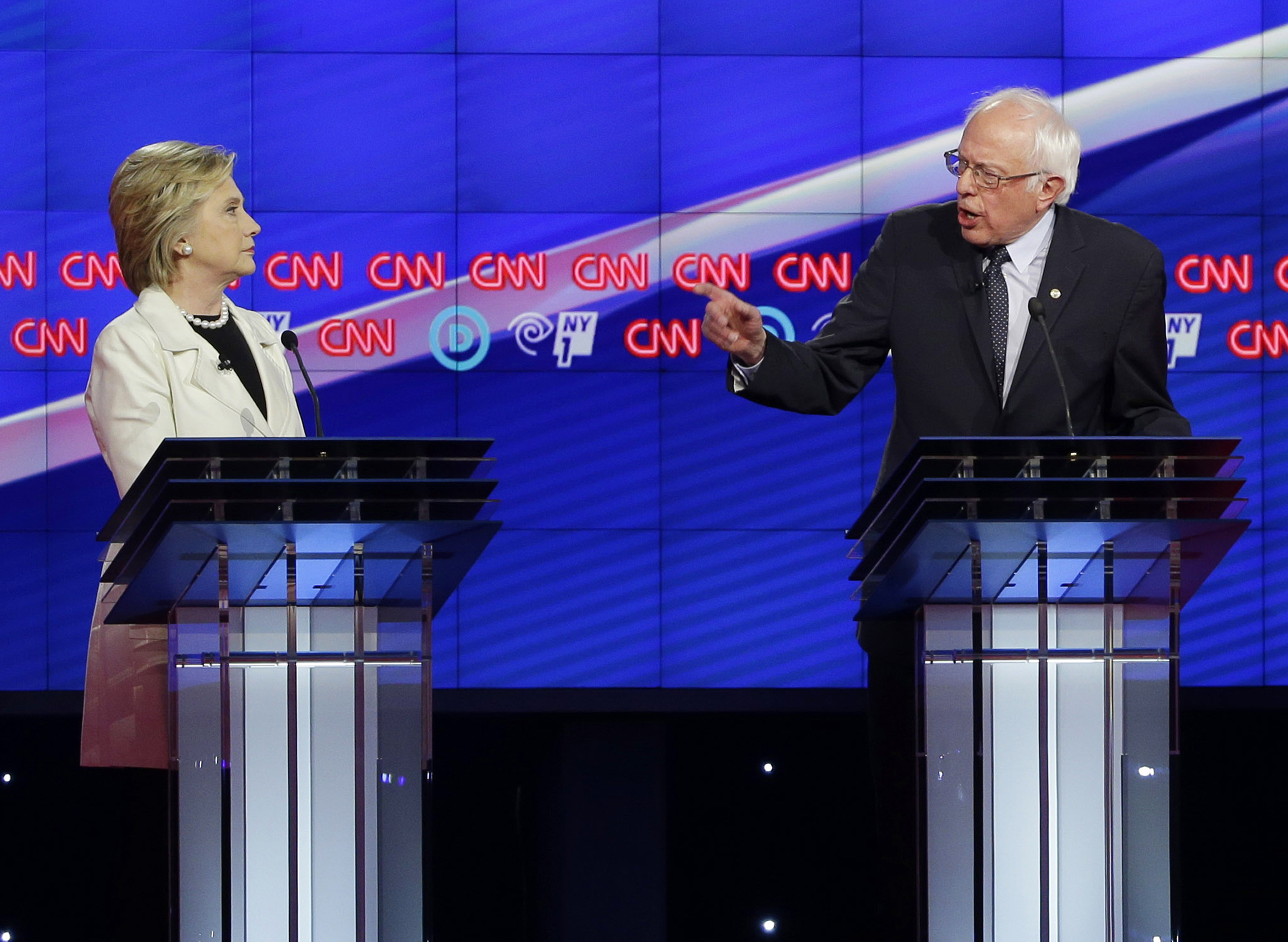Democratic presidential candidates Sen. Bernie Sanders, I-Vt., right, and Hillary Clinton speak during the CNN Democratic Presidential Primary Debate at the Brooklyn Navy Yard on Thursday, April 14, 2016 in New York. (AP Photo/) (AP/Seth Wenig)