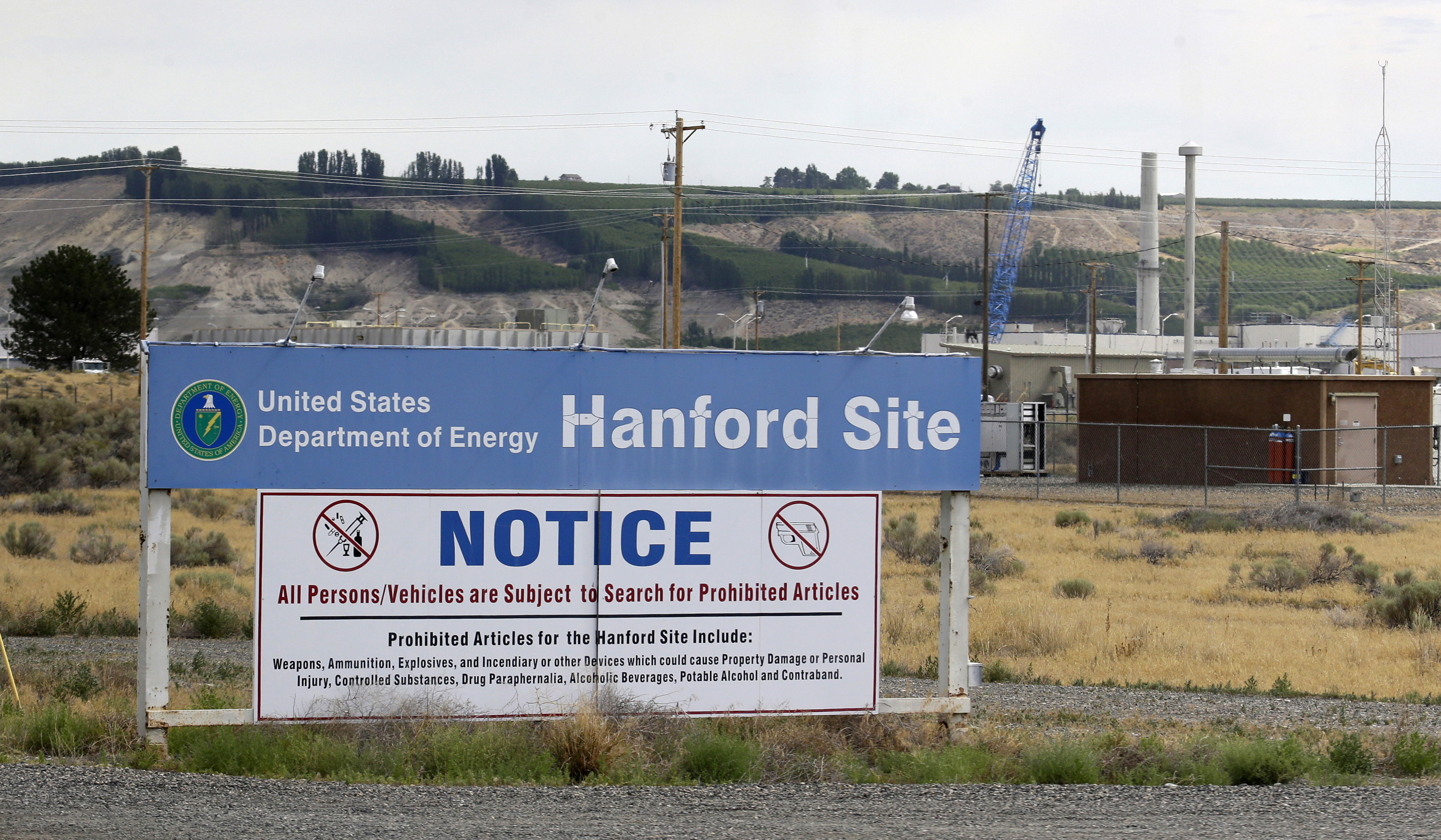 FILE - In this July 9, 2014, file photo, a sign informs visitors of prohibited items on the Hanford Nuclear Reservation near Richland, Wash. Officials for the Hanford Nuclear Reservation are trying to determine if a second giant underground tank containing radioactive waste from the production of plutonium for nuclear weapons is leaking, the U.S. Department of Energy revealed. (AP Photo/Ted S. Warren, File) (AP)