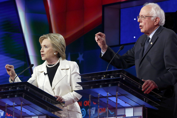 Hillary Clinton and Senator Bernie Sanders speak simultaneously during a Democratic debate, April 14, 2016. (Reuters/Lucas Jackson)