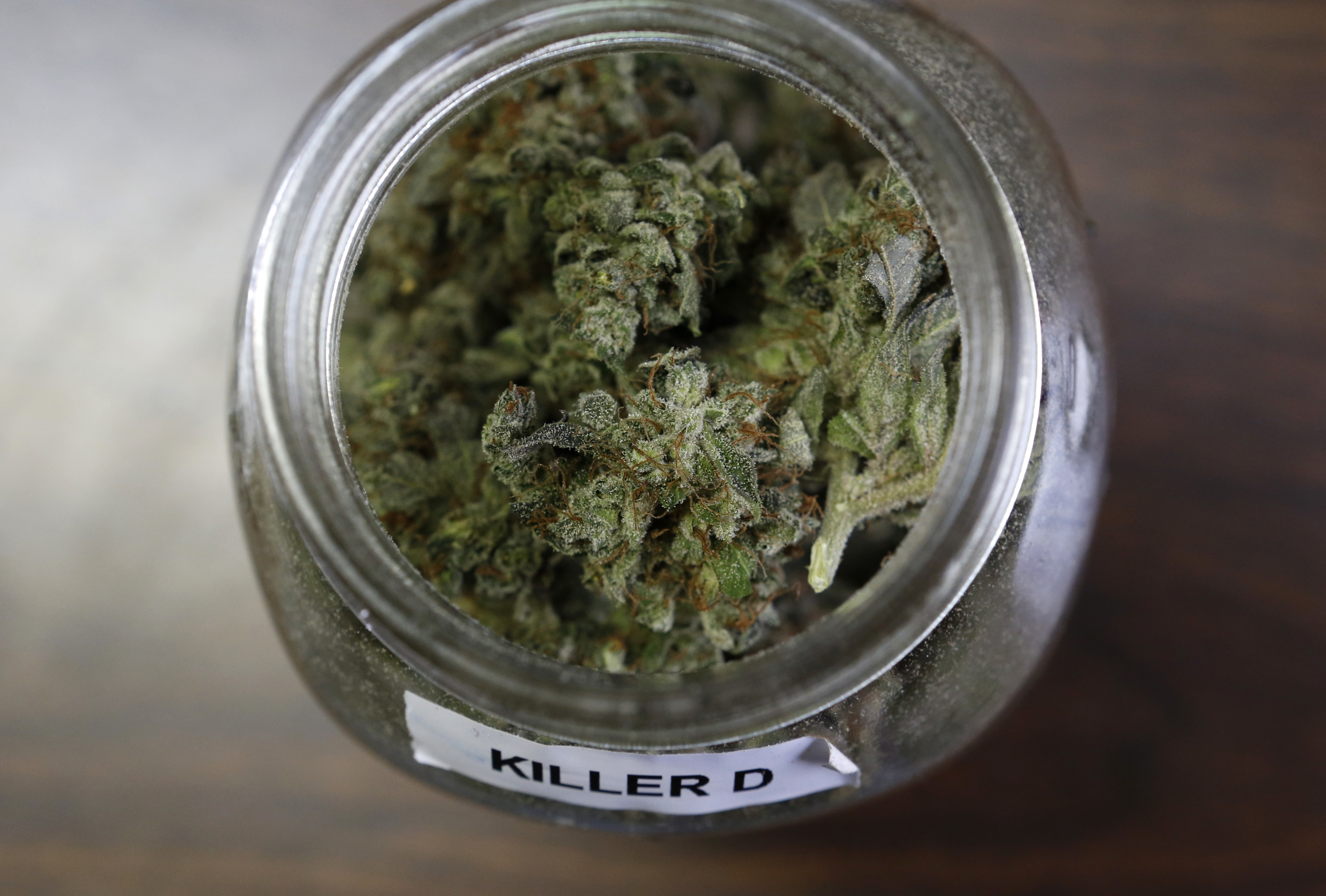 In this Friday, April 22, 2016 photo, a jar containing a strain of marijuana nicknamed "Killer D" is seen at a medical marijuana facility in Unity, Maine. A growing number of health experts and law enforcement officials are making the case that marijuana could help reduce the numbers of overdoses and redirect money into fighting heroin and other opiates. (AP Photo/Robert F. Bukaty) (AP)