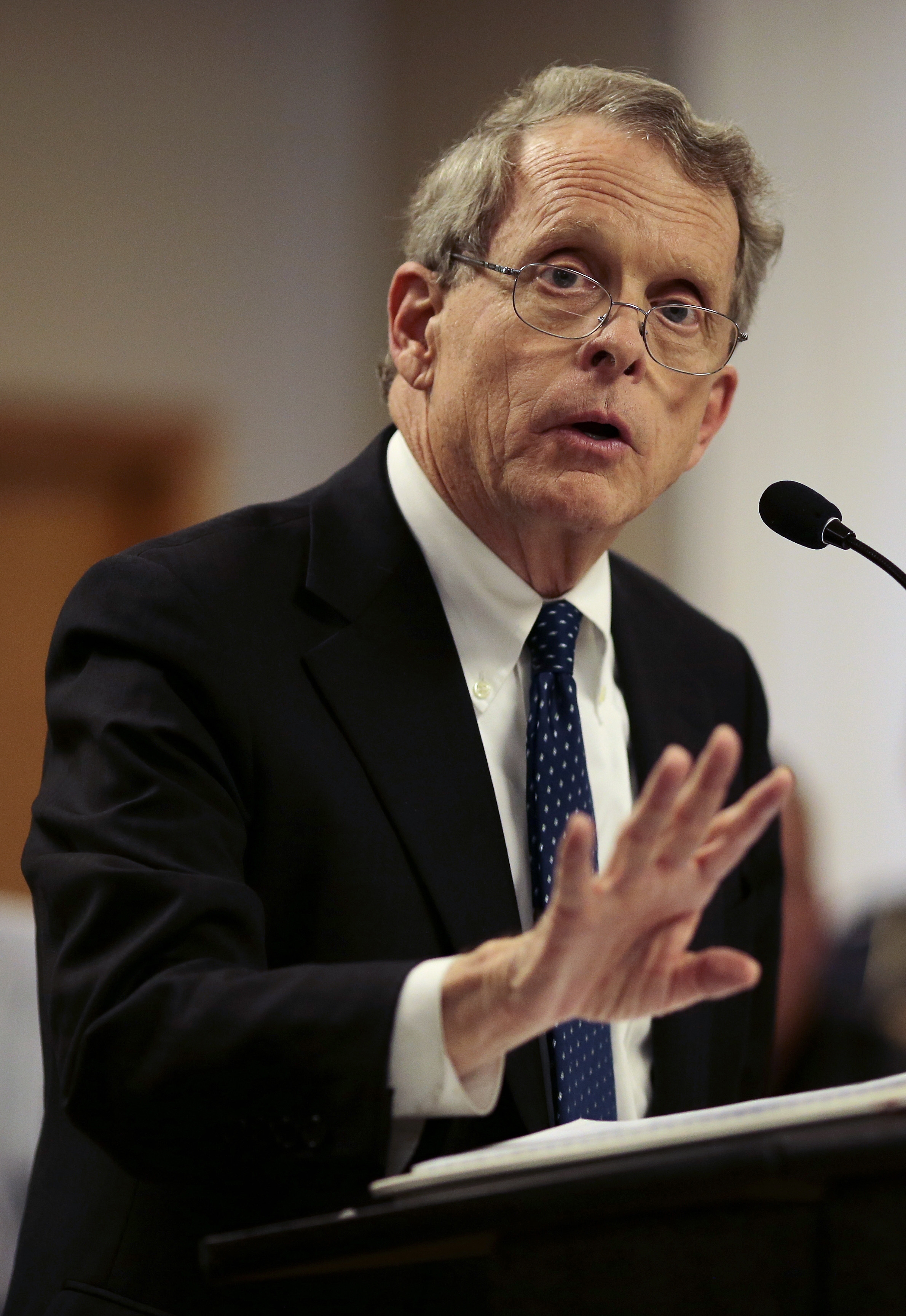 FILE- In this April 22, 2016, file photo, Ohio State Attorney General Mike DeWine speaks during a news conference in Piketon, Ohio. Authorities are scrambling to determine who killed eight family members in a "pre-planned execution" that has shaken residents of their rural southern Ohio community. DeWine on Sunday, April 24, described the killings near the small community of Piketon as "a sophisticated operation. (Sam Greene/The Cincinnati Equirer via AP, File) MANDATORY CREDIT; NO SALES (AP)