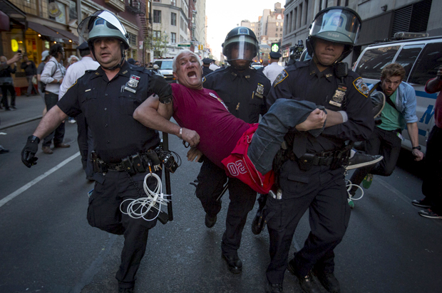 A protester is detained by New York police during a demonstration calling for social, economic and racial justice, in New York City, April 29, 2015. (Reuters/Andrew Kelly)