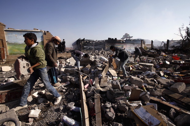 Yemenis sift through rubble after the Saudi-led coalition bombed a school cafeteria in Yemen's capital Sanaa, on February 12, 2016 (Reuters/Mohamed al-Sayaghi)