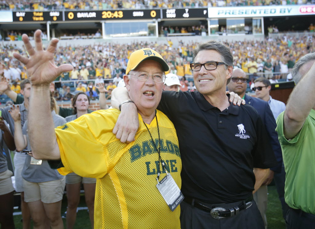 Baylor Bears president Ken Starr and Texas Governor Rick Perry prior to the start of the inaugural game between Baylor University and Southern Methodist University at McLane Stadium in Waco on Sunday, August 31, 2014. (Vernon Bryant/The Dallas Morning News)