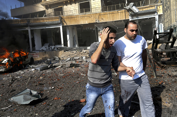 The site of explosions in the suburb of Beir Hassan, Beirut, Lebanon, Feb. 19, 2014, where two suicide attackers from an al-Qaida-linked group blew themselves up. (AP/Hussein Malla)