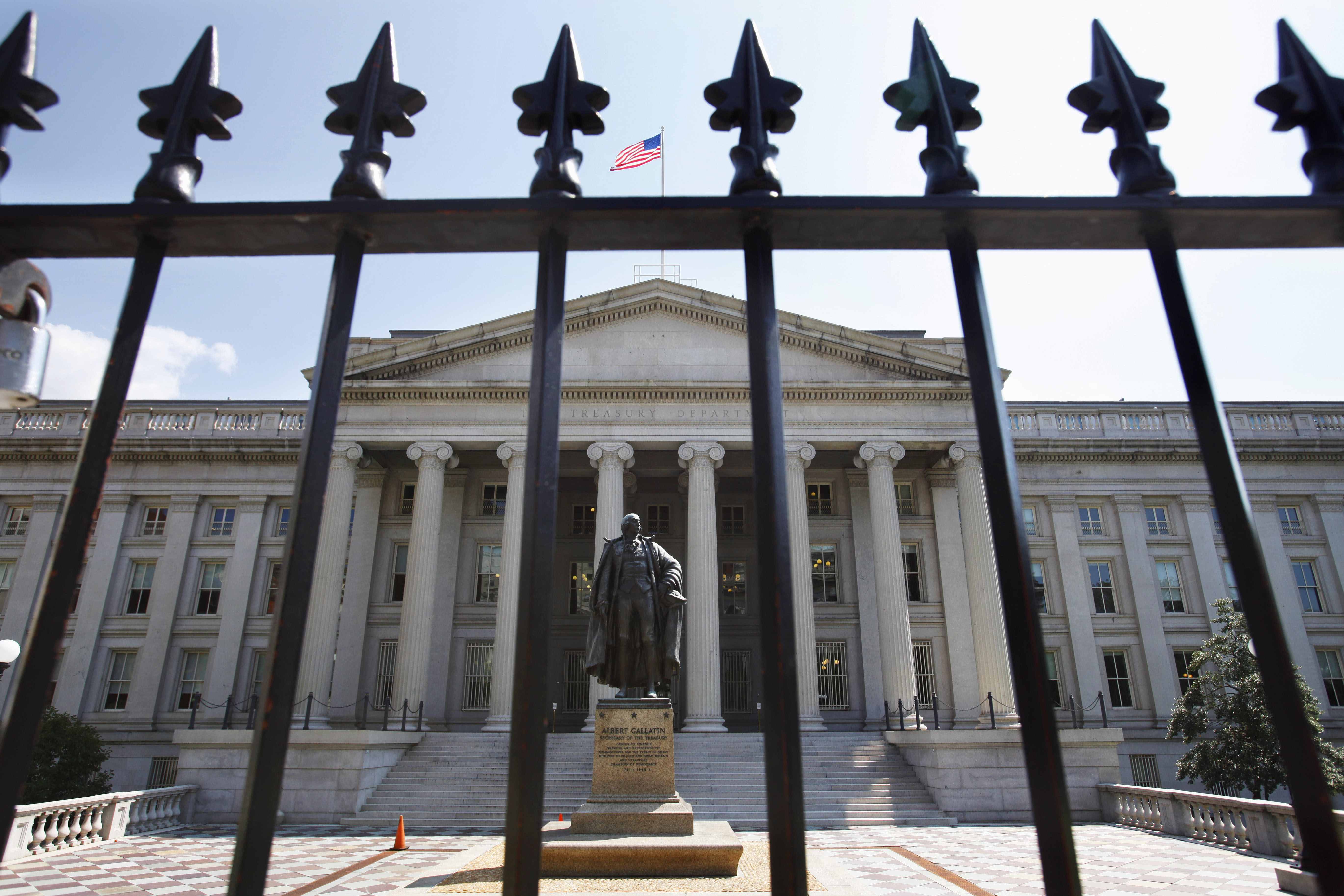 FILE - In this Monday, Aug. 8, 2011, file photo, a statue of former Treasury Secretary Albert Gallatin stands guard outside the Treasury Building in Washington. (AP Photo/Jacquelyn Martin, File) (AP)
