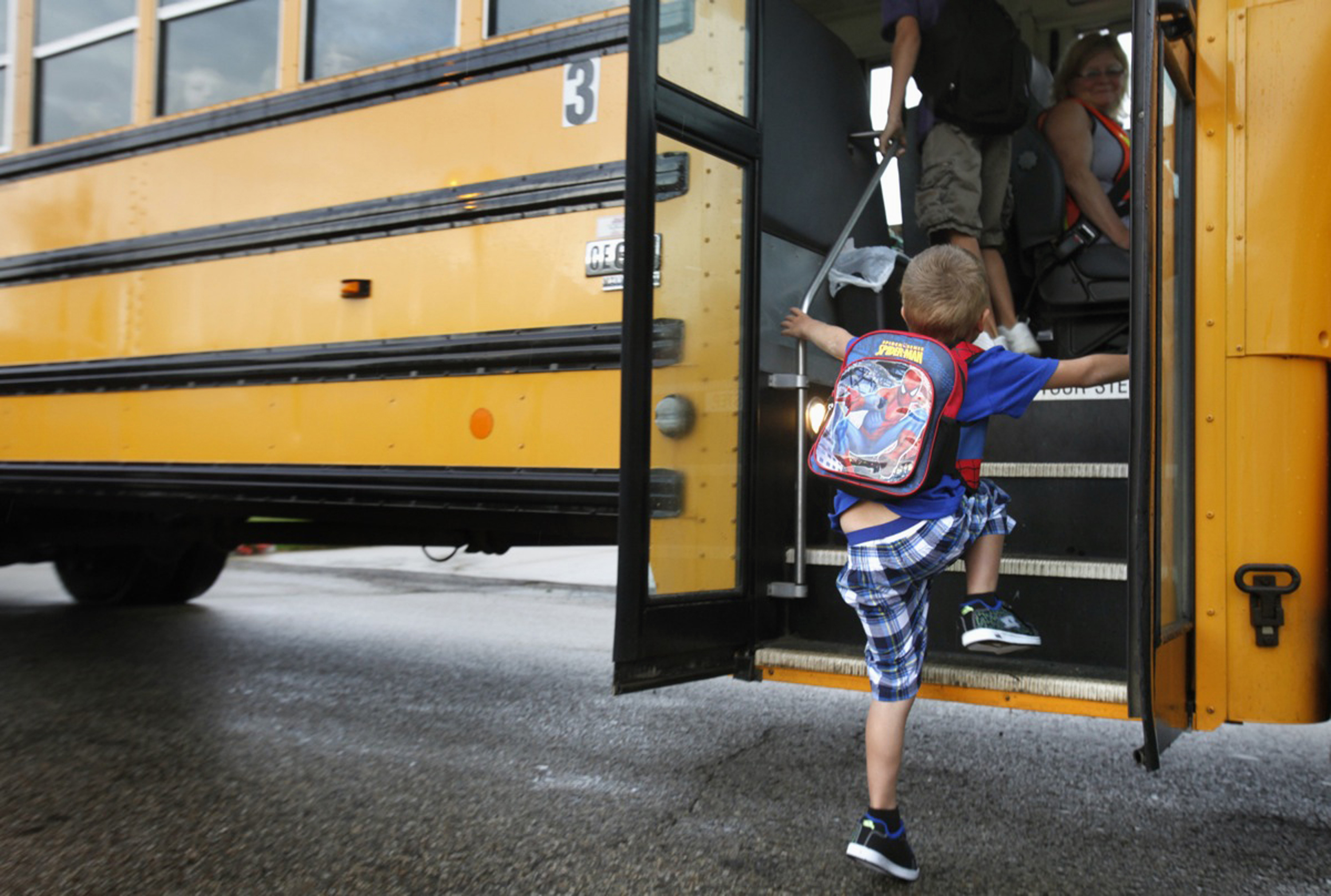 FILE - In this Sept. 4, 2012 file photo, a student at Indian Lake Elementary in Kalamazoo, Mich., boards a bus on the first day of school. Bullying is a serious public health problem, and should no longer be dismissed as merely a matter of kids being kids, a leading panel of experts warned Tuesday, May 10, 2016. Bullying behavior is seen as early as preschool and peaks during the middle school years, the researchers said. And the problem has morphed from the traditional bully-in-the-schoolyard scenario to newer forms of electronic aggression, such as cyberbullying on social media sites. (AP Photo/The Kalamazoo Gazette, Mark Bugnaski, File) (AP)