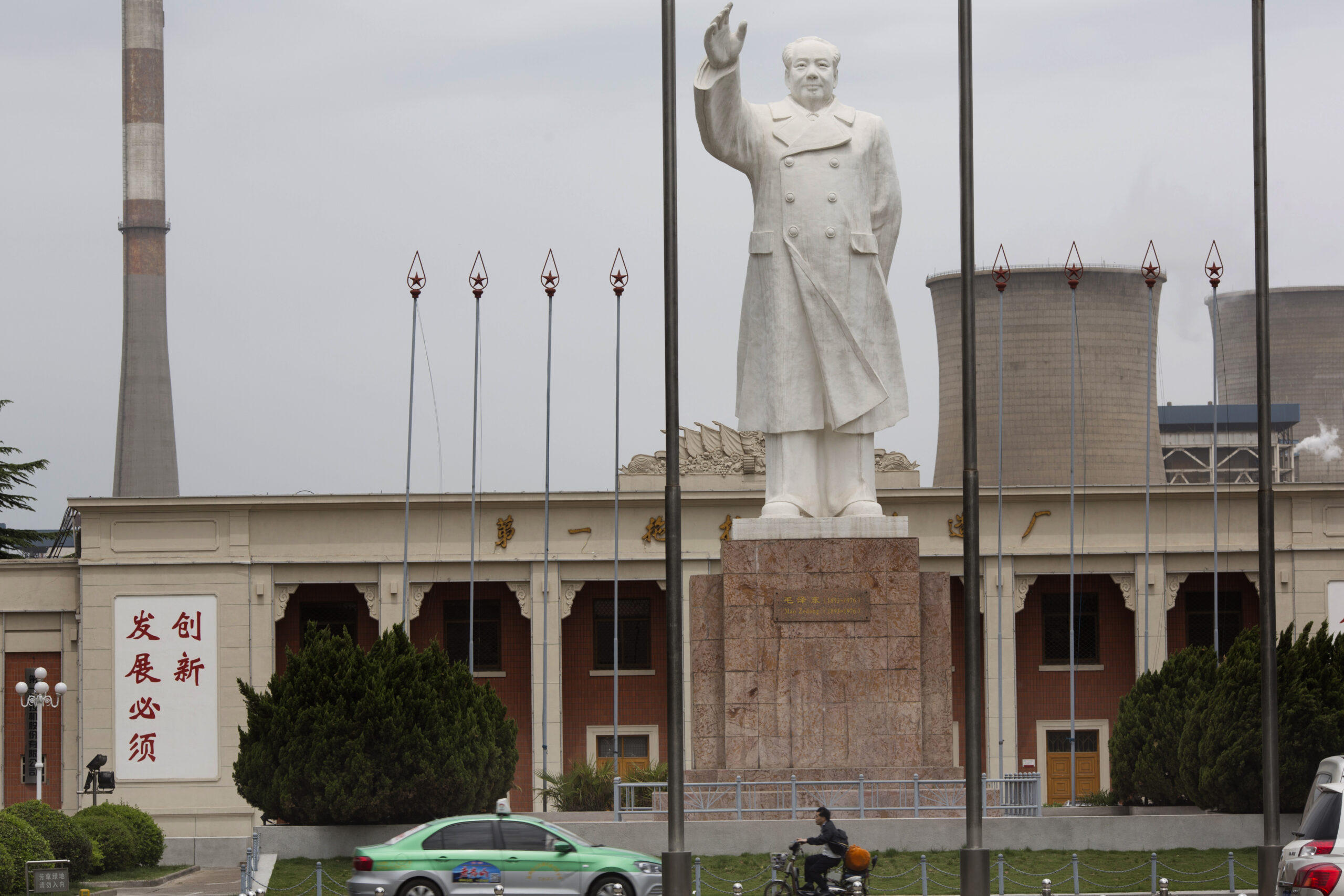 In this photo taken Monday, May 2, 2016, an enormous statue of Mao Zedong looms over the No. 1 Tractor Factory in Luoyang in central China's Henan province. Fifty years after Mao unleashed the decade-long Cultural Revolution to reassert his authority and revive his radical communist agenda, the spirit of modern China's founder still exerts a powerful pull. Millions of people were persecuted, publicly humiliated, beaten or killed during the upheaval, as zealous factionalism metastasized countrywide, tearing apart Chinese society at a most basic level. () (AP Photo/Ng Han Guan)