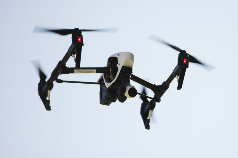FILE - In this April 14, 2016 file photo, a drone operated captures videos and still images of an apartment building in Philadelphia. A panel of privacy experts and technology companies organized by the Obama administration has issued guidelines for using drones without being overly intrusive. The suggestions are voluntary, but some business interests involved in the debate hope the guidelines head off tougher regulations that they fear could smother the drone industry in its infancy. (AP Photo/Matt Rourke, File) (AP)