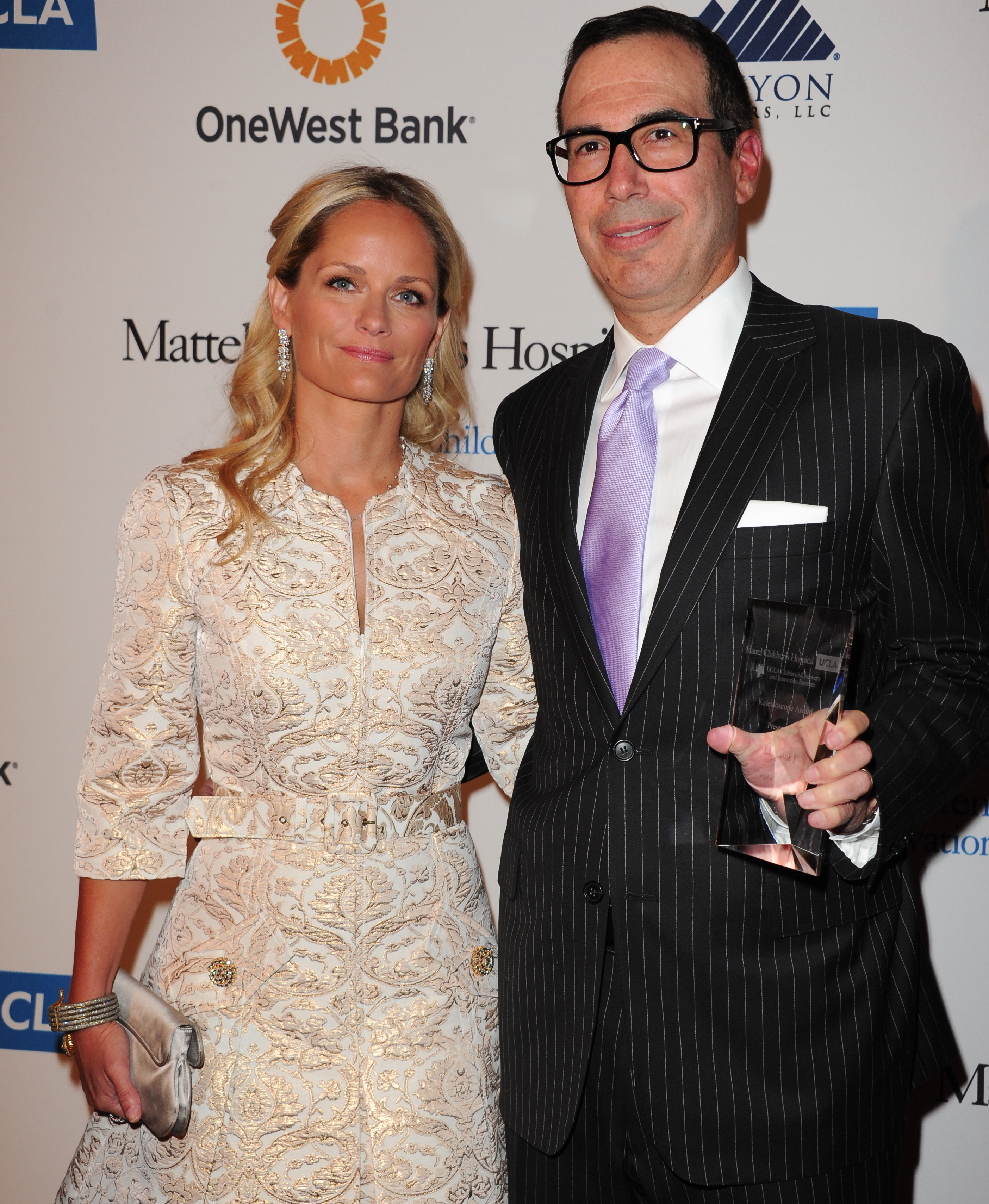 FILE - In this April 17, 2013 file photo, Heather Mnuchin, left, and Steven Mnuchin arrive at The Kaleidoscope Ball's "Designing The Future" at the Beverly Hills Hotel in Beverly Hills, Calif. (Richard Shotwell/invision/ap)