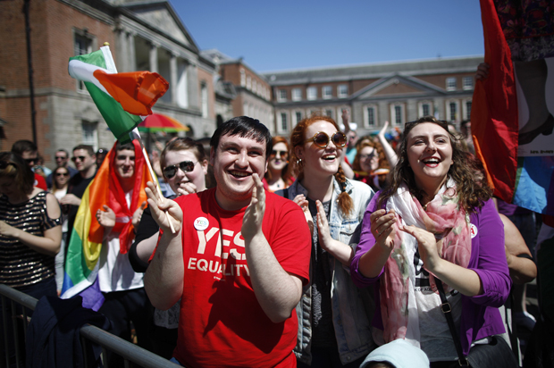 Yes supporters celebrate as first results in the Irish referendum start to come through at Dublin castle,  Ireland, May 23, 2015. (AP/Peter Morrison)