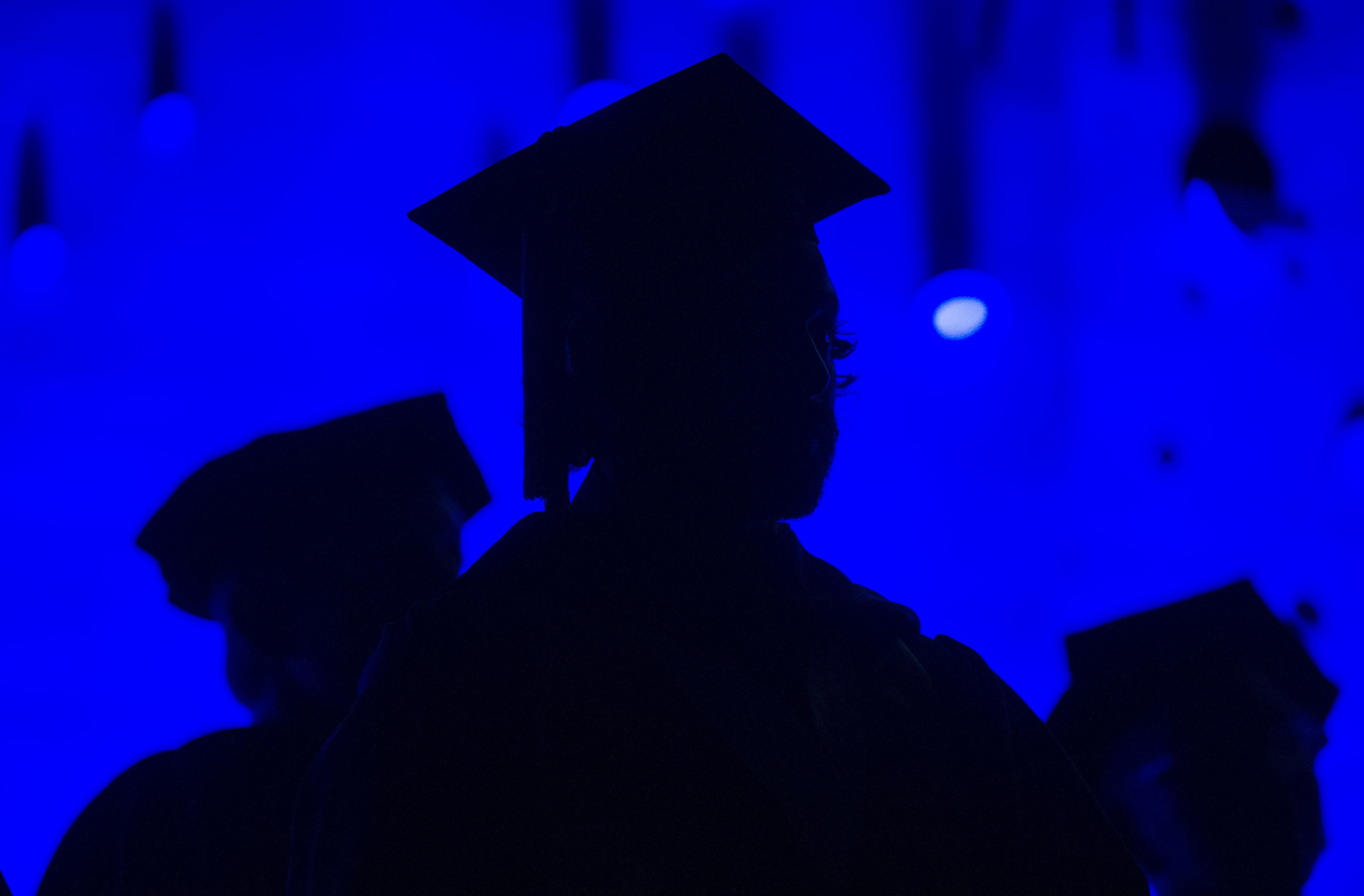 FILE - In this Saturday, May 31, 2014, file photo, members of the graduating class and faculty attend the Savannah College of Art and Design commencement in Atlanta. For the first time on record, living with parents is now the most common arrangement for Americans ages 18 to 34, an analysis of Census data by the Pew Research Center has found. The sharp shift reflects a long-running decline in marriage age, amplified by the economic upheavals of the Great Recession. The trend has been particularly evident among Americans who lack a college degree. (AP Photo/John Amis, File) (AP)