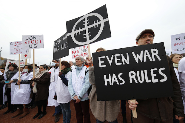 Doctors Without Borders staff protest in Geneva, Switzerland on November 3, 2015, one month after the U.S. bombing of their hospital in Kunduz, Afghanistan (Reuters/Denis Balibouse)