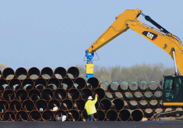FILE - In this May 9, 2015 file photo, pipes for the proposed Dakota Access oil pipeline that will stretch from the Bakken oil fields in North Dakota to Illinois are stacked at a staging area in Worthing, S.D. Construction on the pipeline is now underway in North Dakota, South Dakota and Illinois, three of the four states that will carry the oil from western North Dakota. The pipeline also will cross Iowa, but regulators there have declined to act quickly on a request to allow Texas-based Energy Transfer Partners to begin construction in that state. (AP Photo/Nati Harnik, File) (AP)