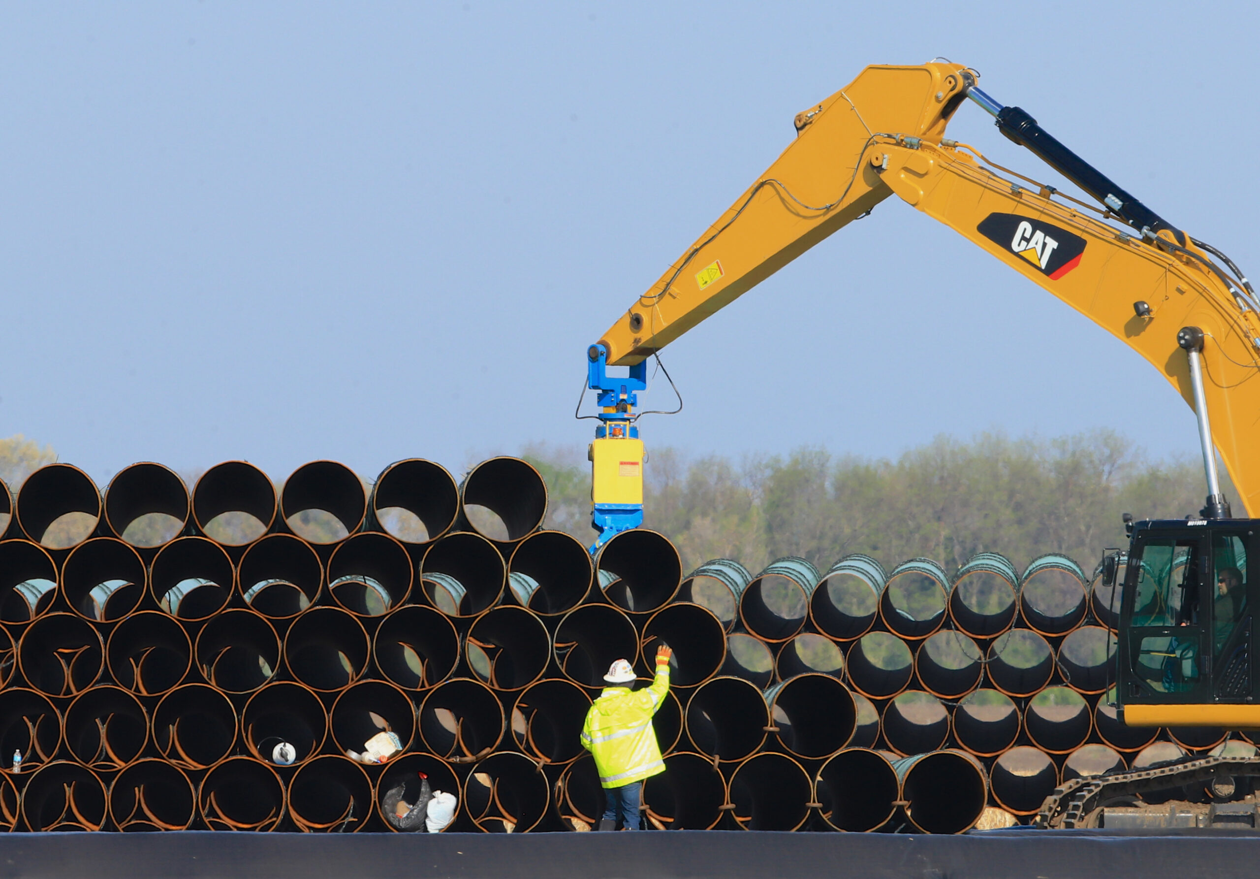 FILE - In this May 9, 2015 file photo, pipes for the proposed Dakota Access oil pipeline that will stretch from the Bakken oil fields in North Dakota to Illinois are stacked at a staging area in Worthing, S.D. Construction on the pipeline is now underway in North Dakota, South Dakota and Illinois, three of the four states that will carry the oil from western North Dakota. The pipeline also will cross Iowa, but regulators there have declined to act quickly on a request to allow Texas-based Energy Transfer Partners to begin construction in that state. (AP Photo/Nati Harnik, File) (AP)
