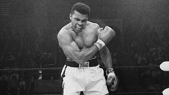 In this May 25, 1965, file photo, heavyweight champion Muhammad Ali stands over fallen challenger Sonny Liston, shouting and gesturing shortly after dropping Liston with a short hard right to the jaw in the first round of their title fight in Lewiston, Maine.