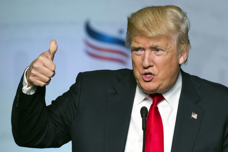 FILE - In this June 10, 2016 file photo, Republican presidential candidate Donald Trump gives a thumbs-up while addressing the Faith and Freedom Coalition's Road to Majority Conference in Washington. Presumptive Republican presidential nominee Donald Trump boils down his foreign policy agenda to two words: “America First.” For students of U.S. history, that slogan harkens back to the tumultuous presidential election of 1940, when hundreds of thousands of Americans joined the anti-war America First Committee. That isolationist group’s primary goal was to keep the United States from joining Britain in the fight against Nazi Germany, which by then had overrun nearly all of Europe. But the committee is also remembered for the unvarnished anti-Semitism of some of its most prominent members and praise for the economic policies of Adolf Hitler.(AP Photo/Cliff Owen, File) (AP)