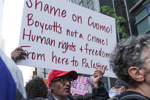 A protester at a demonstration against New York Gov. Cuomo's anti-BDS executive order, in New York City on June 9, 2016 (Jewish Voice for Peace/Jake Ratner)