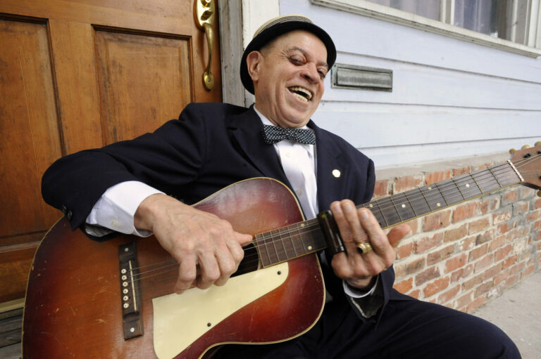 In this Tuesday, April 12, 2016 photo, musician "Deacon" John Moore holds his guitar in New Orleans. At 74, he remembers a time when America was headed in the right direction, when everything seemed to be coming together. It was in the 1960s, when black people like himself were seeing an end to racial segregation; when women were gaining equality; when politicians were taking a stand to end poverty despite the turmoil of protests over the Vietnam War. "Those were the best years," said Moore. "And then they were destroyed right before my very eyes when they assassinated all of our leaders. Robert Kennedy. John Kennedy. Martin Luther King. Malcom X. All of our leaders. And, you know, that was the end of hope. We had no more hope." (AP Photo/Jay Reeves) (AP)
