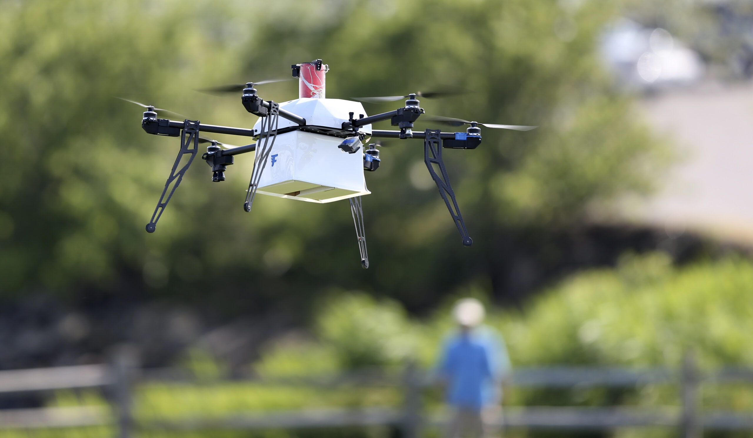 A drone aircraft with a payload of simulated blood, and other medical samples flies during a ship-to-shore delivery simulation Wednesday, June 22, 2016, in Lower Township, N.J. How to distribute lifesaving supplies quickly and safely after a natural disaster has long been a puzzle for responders. Now, drones might be the lifesaver. That idea was put to the test this week on the New Jersey coast as a drone delivery conducted test flights to help determine whether drones can be used to carry human medical samples to and from areas during major natural disasters. (AP Photo/Mel Evans) (AP)
