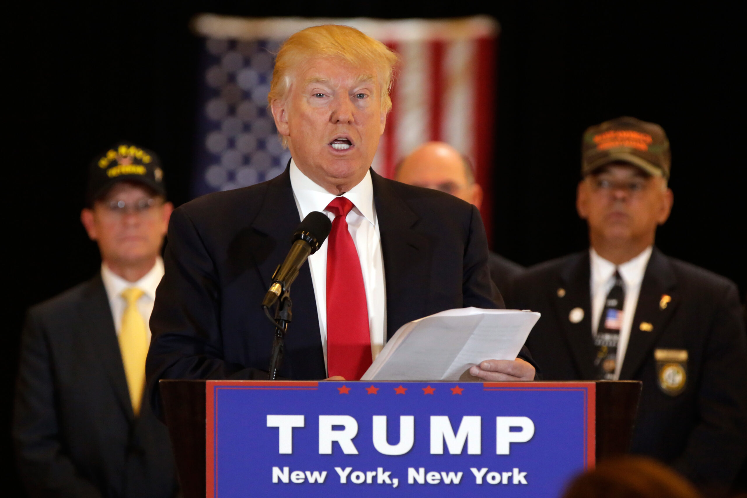 Republican presidential candidate Donald Trump reads from a list of donations to veteran's groups, during a news conference in New York, Tuesday, May 31, 2016. (AP Photo/Richard Drew) (AP)