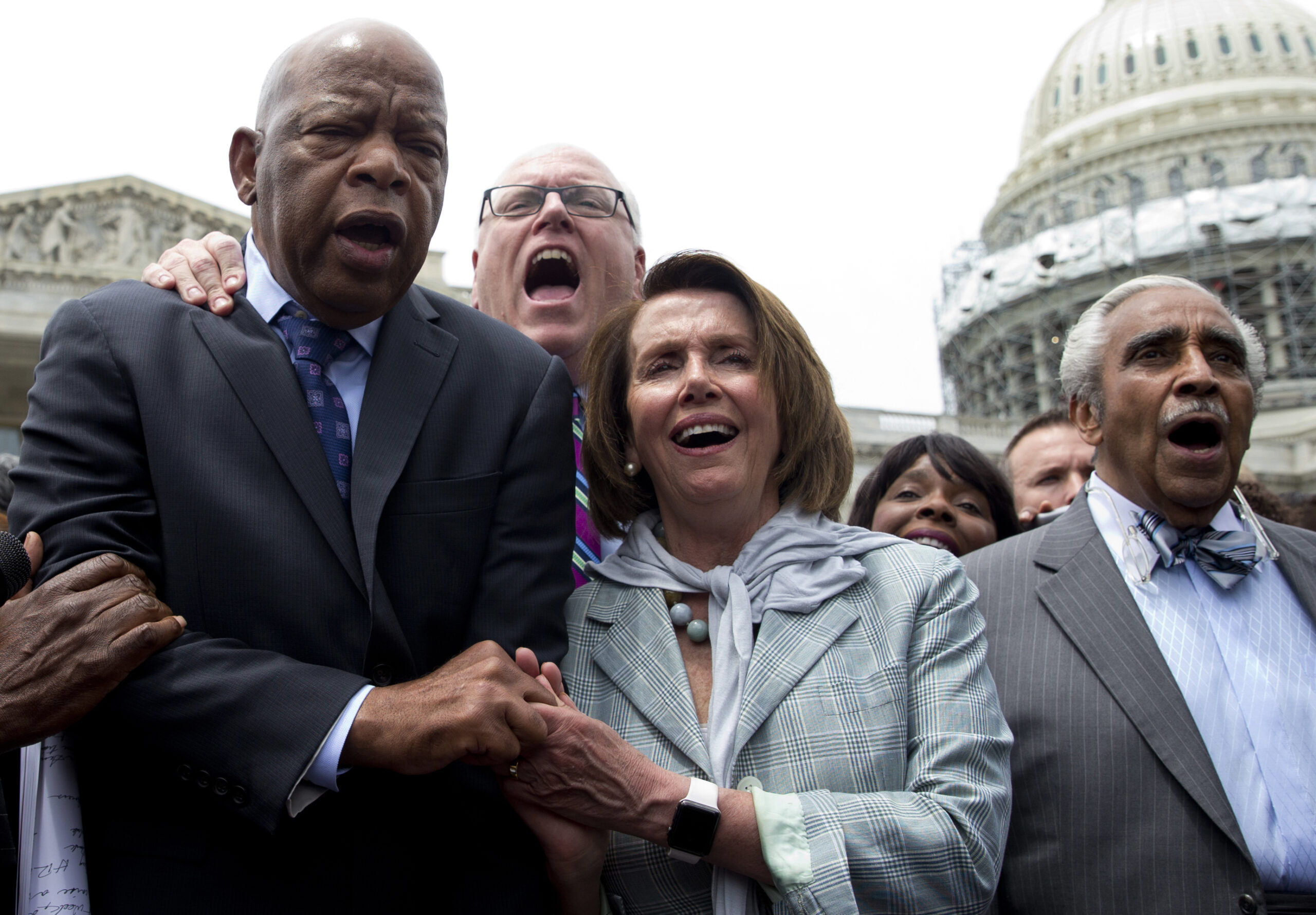 From left, Rep. John Lewis, D-Ga., Rep. Joseph Crowley, D-N.Y., House Minority Leader Nancy Pelosi of Calif. and Rep. Charles Rangel, D-N.Y., sing "We Shall Overcome" on Capitol Hill in Washington, Thursday, June 23, 2016, after House Democrats ended their sit-in protest. (AP Photo/Carolyn Kaster) (AP)