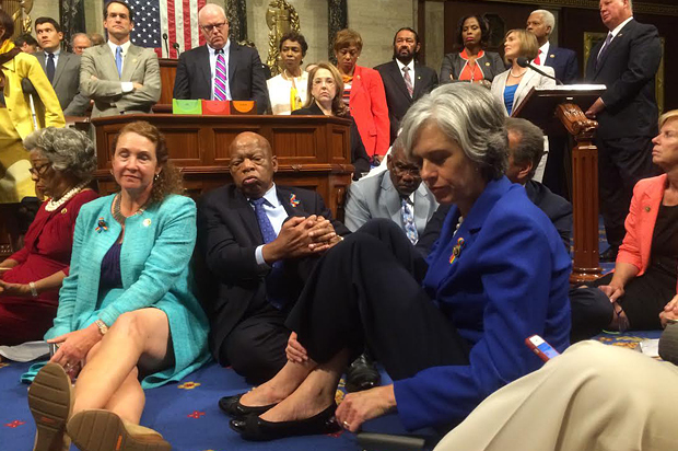 A photo shot and tweeted from the floor of the U.S. House of Representatives by U.S. House Rep. Katherine Clark shows Democratic members of the House staging a sit-in on the House floor "to demand action on common sense gun legislation," June 22, 2016. (Reuters/U.S. Rep. Katherine Clark)