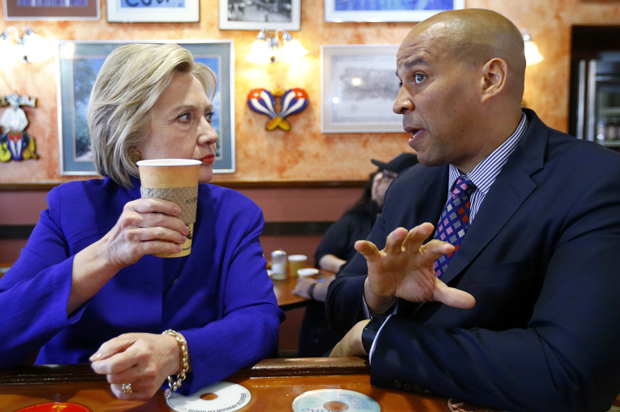 Hillary Clinton talks with Cory Booker at Omar's Cafe in Newark, NJ, June 1, 2016. (AP/Julio Cortez)