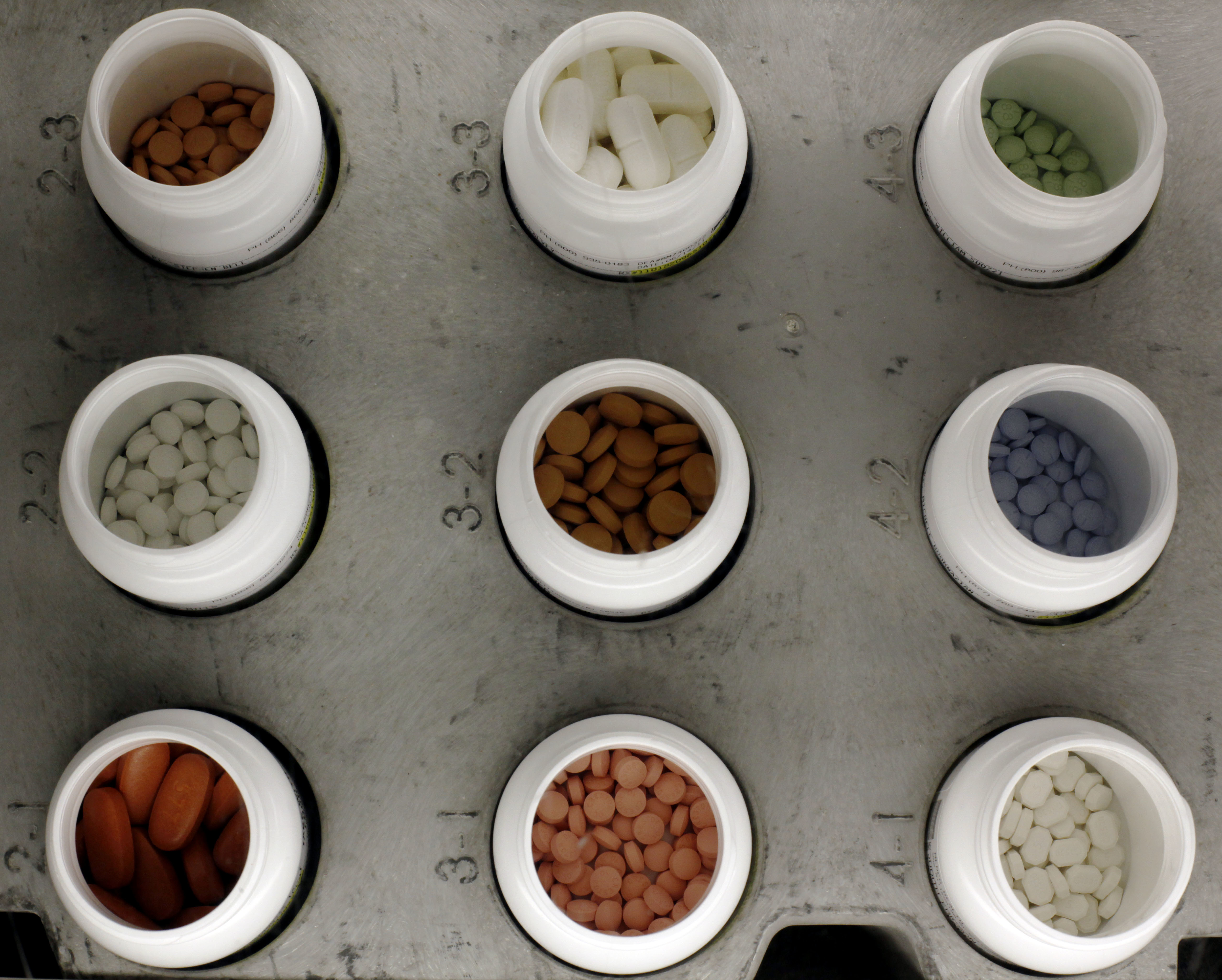 FILE - In this June 14, 2011 file photo, various prescription drugs on the automated pharmacy assembly line at Medco Health Solutions in Willingboro, N.J. Calling the rising cost of drugs “unsustainable,” congressional advisers Wednesday, June 15, 2016, recommended major changes to Medicare’s popular outpatient prescription program, now 10 years old.  (AP Photo/Matt Rourke, File) (AP)