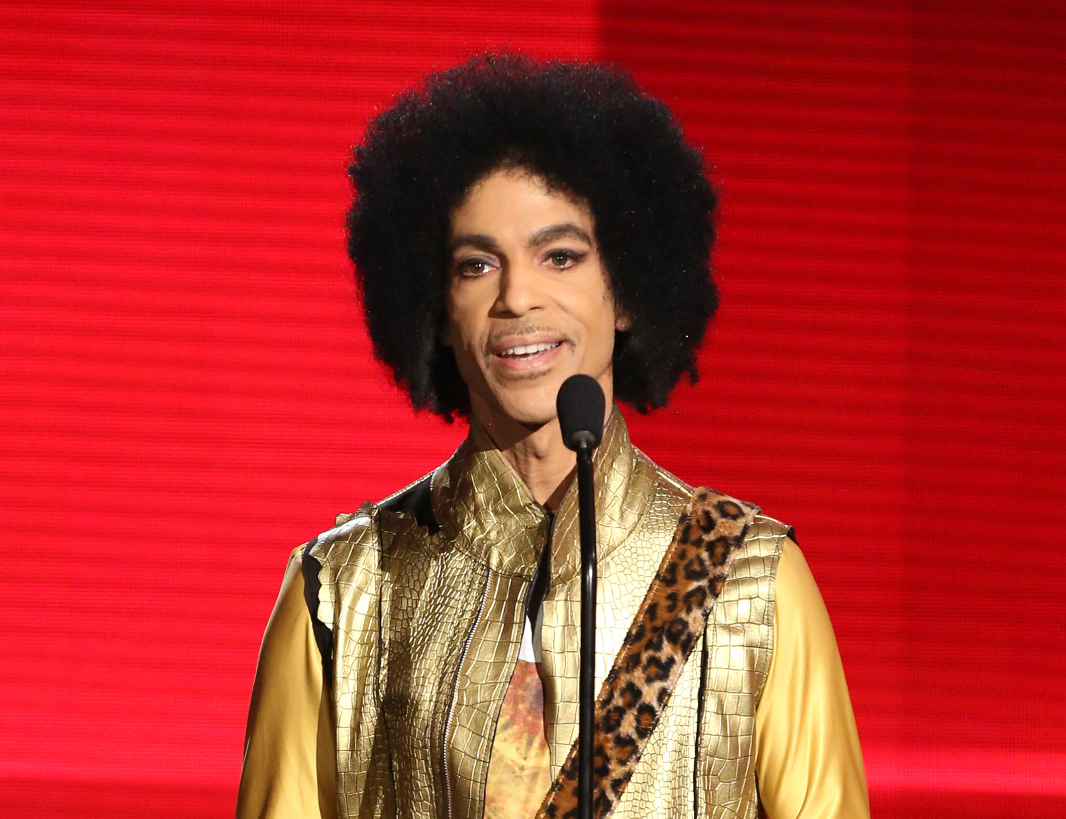 FILE - In this Nov. 22, 2015 file photo, Prince presents the award for favorite album - soul/R&B at the American Music Awards in Los Angeles. A law-enforcement official says that tests show the music superstar died of an opioid overdose. Prince was found dead at his home on April 21, 2016, in suburban Minneapolis. He was 57. (Photo by Matt Sayles/Invision/AP, File) (Matt Sayles/Invision/AP)