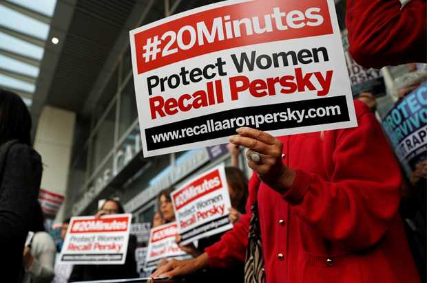 Activists hold signs calling for the removal of Judge Aaron Persky from the bench, San Francisco, California, June 10, 2016. (Reuters/Stephen Lam)