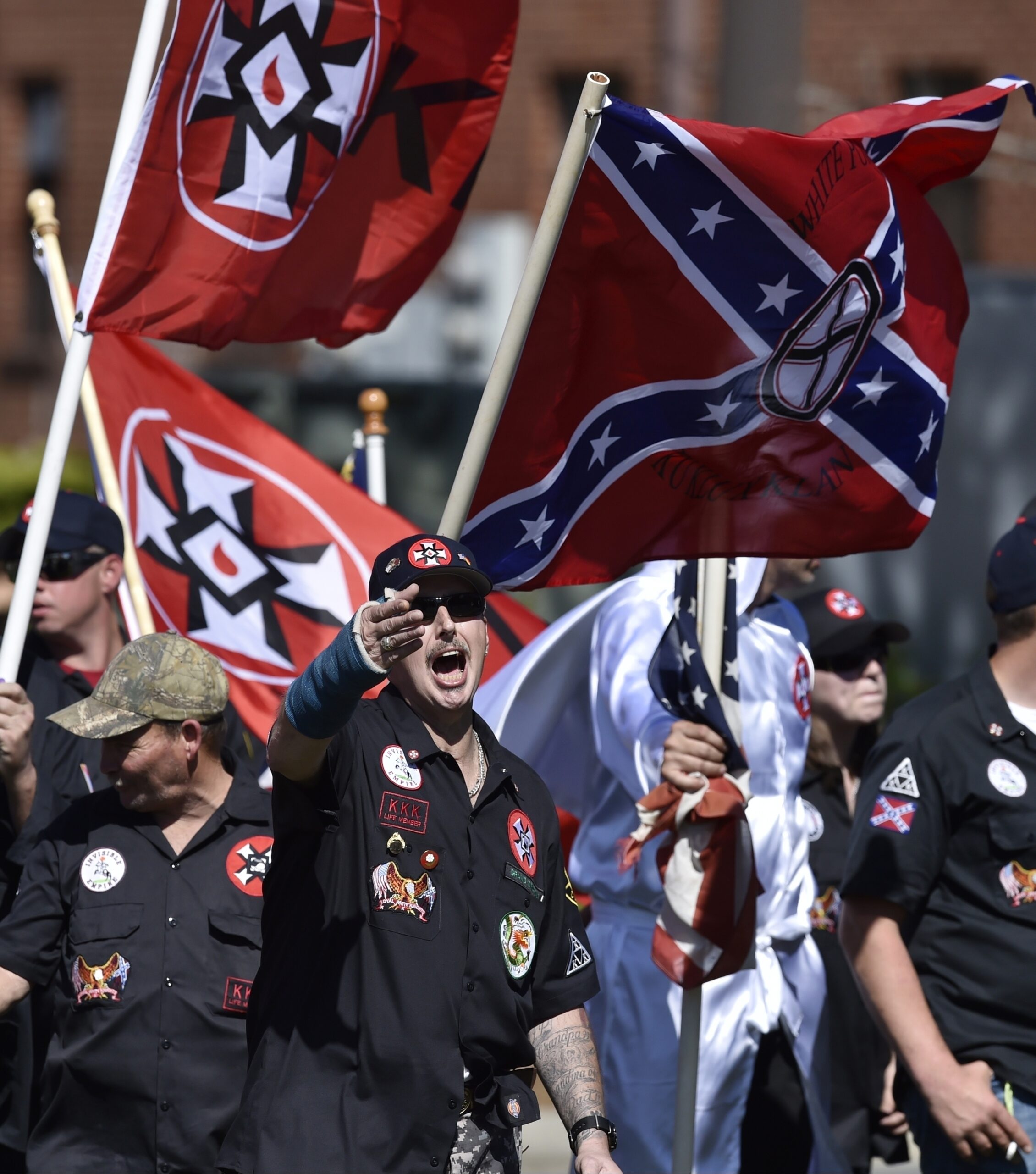 In this Saturday, April 23, 2016 photo, Loyal White Knights Grand Dragon Will Quigg of Anaheim, Calif., center, shouts to protestors during a "White Pride," rally, in Rome, Ga. (AP)