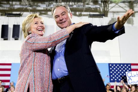 In this July 14, 2016, file photo, Democratic presidential candidate Hillary Clinton, accompanied by Sen. Tim Kaine, D-Va., speaks at a rally at Northern Virginia Community College in Annandale, Va. Clinton has chosen Kaine to be her running mate ((AP Photo/Andrew Harnik))