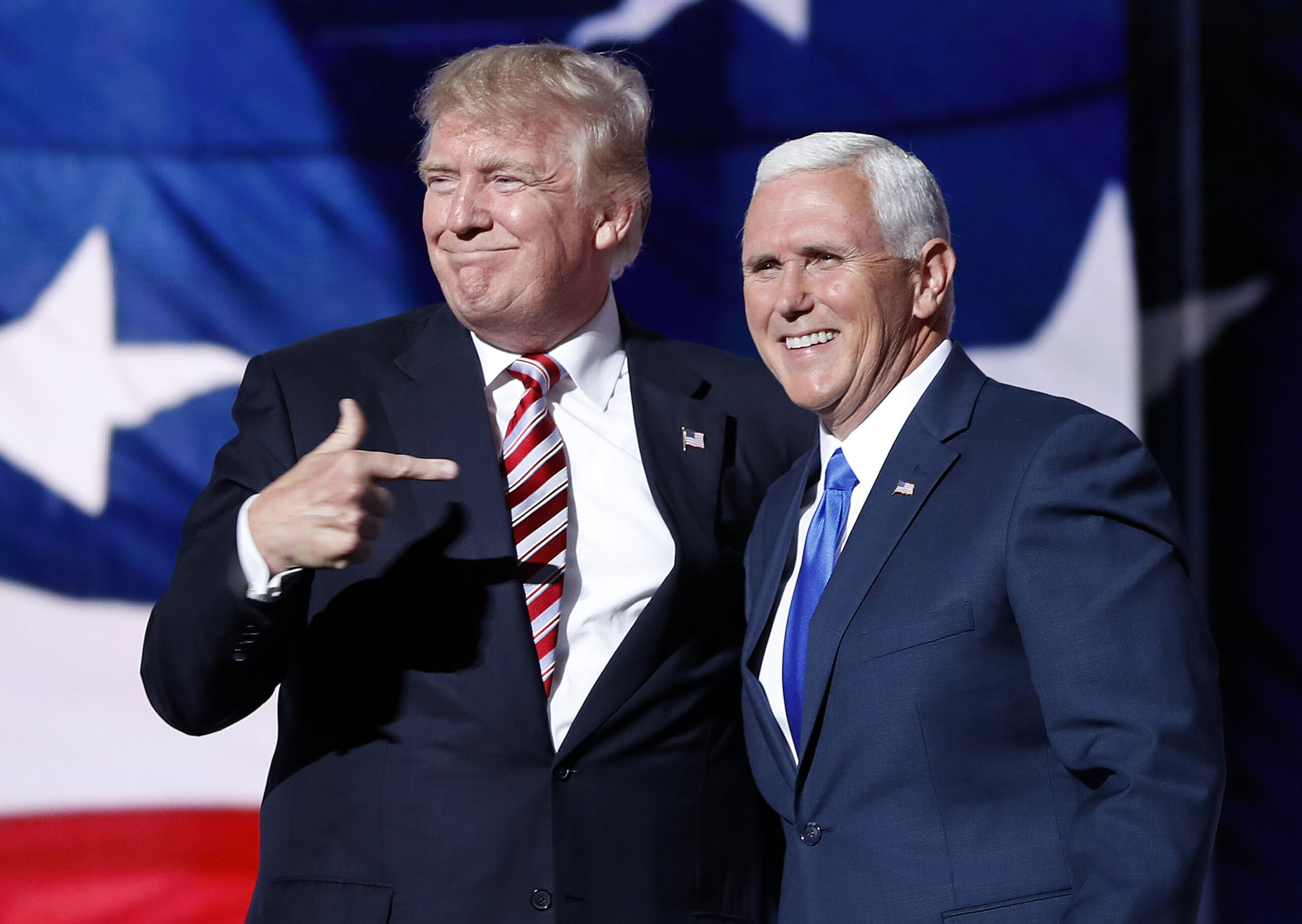 Republican presidential candidate Donald Trump, points toward Republican vice presidential candidate Indiana Gov. Mike Pence after Pence's acceptance speech during the third day session of the Republican National Convention in Cleveland, Wednesday, July 20, 2016. (AP Photo/Mary Altaffer) (AP)