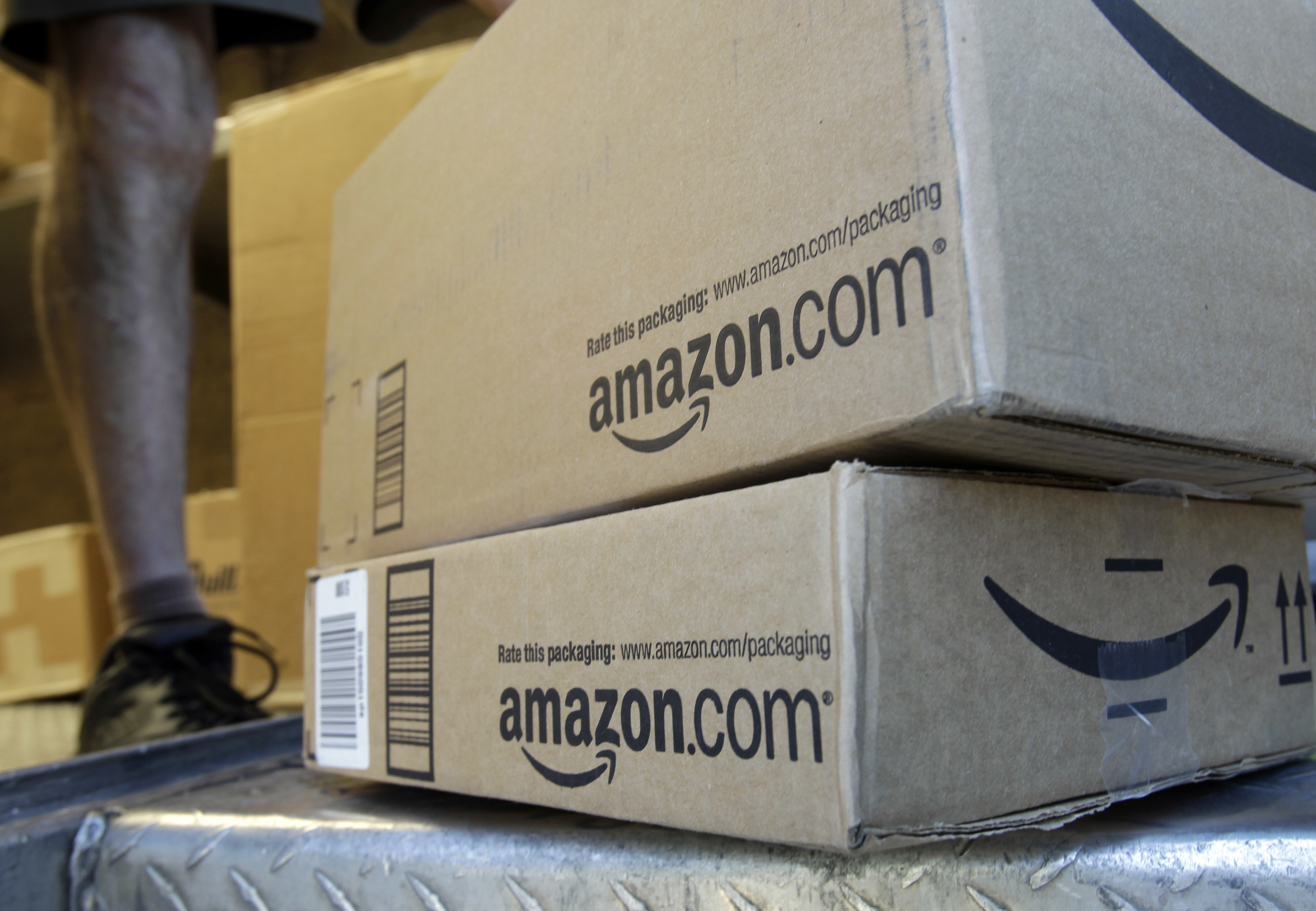 FILE - In this June 30, 2011 file photo, a United Parcel Service driver delivers packages from Amazon.com in Palo Alto, Calif. Amazon is offering deals July 12, 2016, for the second edition of its annual "Prime Day" promotion. (AP Photo/Paul Sakuma, File) (AP)