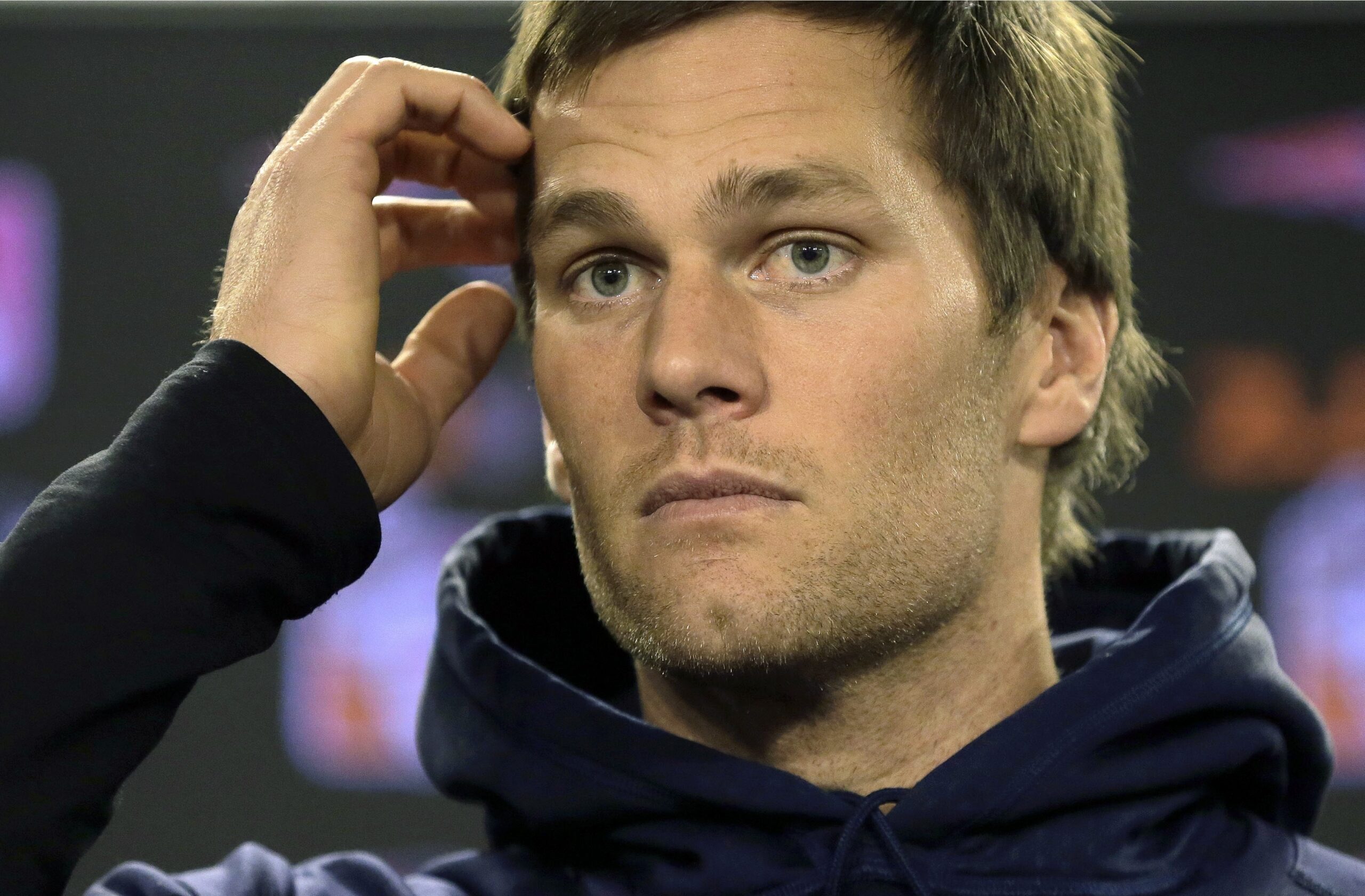 FILE - In this Jan. 6, 2016 file photo, New England Patriots quarterback Tom Brady faces reporters before a scheduled NFL football practice in Foxborough, Mass. On Wednesday, July 13, 2016, a federal appeals court has rejected Tom Brady's attempt to get a new hearing on his suspension. Brady was asking for the full 2nd U.S. Circuit Court of Appeals to hear the case. In April, a three-judge panel said that NFL commissioner Roger Goodell was within his powers when he suspended the star quarterback four games for his role in a scheme to doctor the footballs used in a Jan. 18, 2015, playoff game. (AP Photo/Steven Senne, File) (AP Photo/Steven Senne, File)