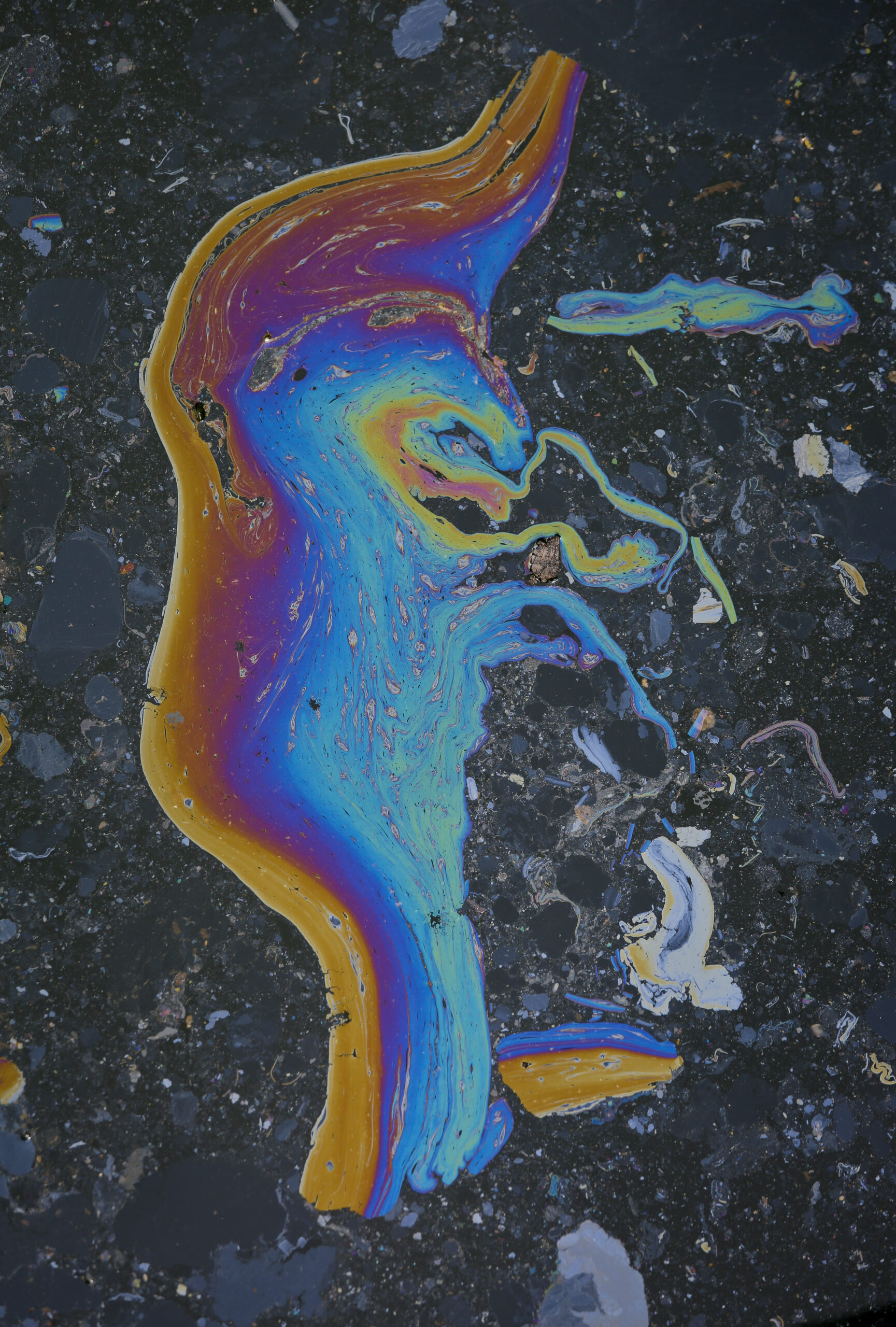 In this Friday, July 1, 2016 photo, a rainbow-color waste slick appears on Brooklyn's Gowanus Canal, in New York. The canal is a Superfund site polluted with decades' worth of industrial waste and sewage, but the developer says the pending more than half a billion dollars cleanup of the toxic waterway hasn't deterred tenants from flocking to the building, where the rent for a one-bedroom apartment starts in the low $3,000s. (AP Photo/Bebeto Matthews) (AP)