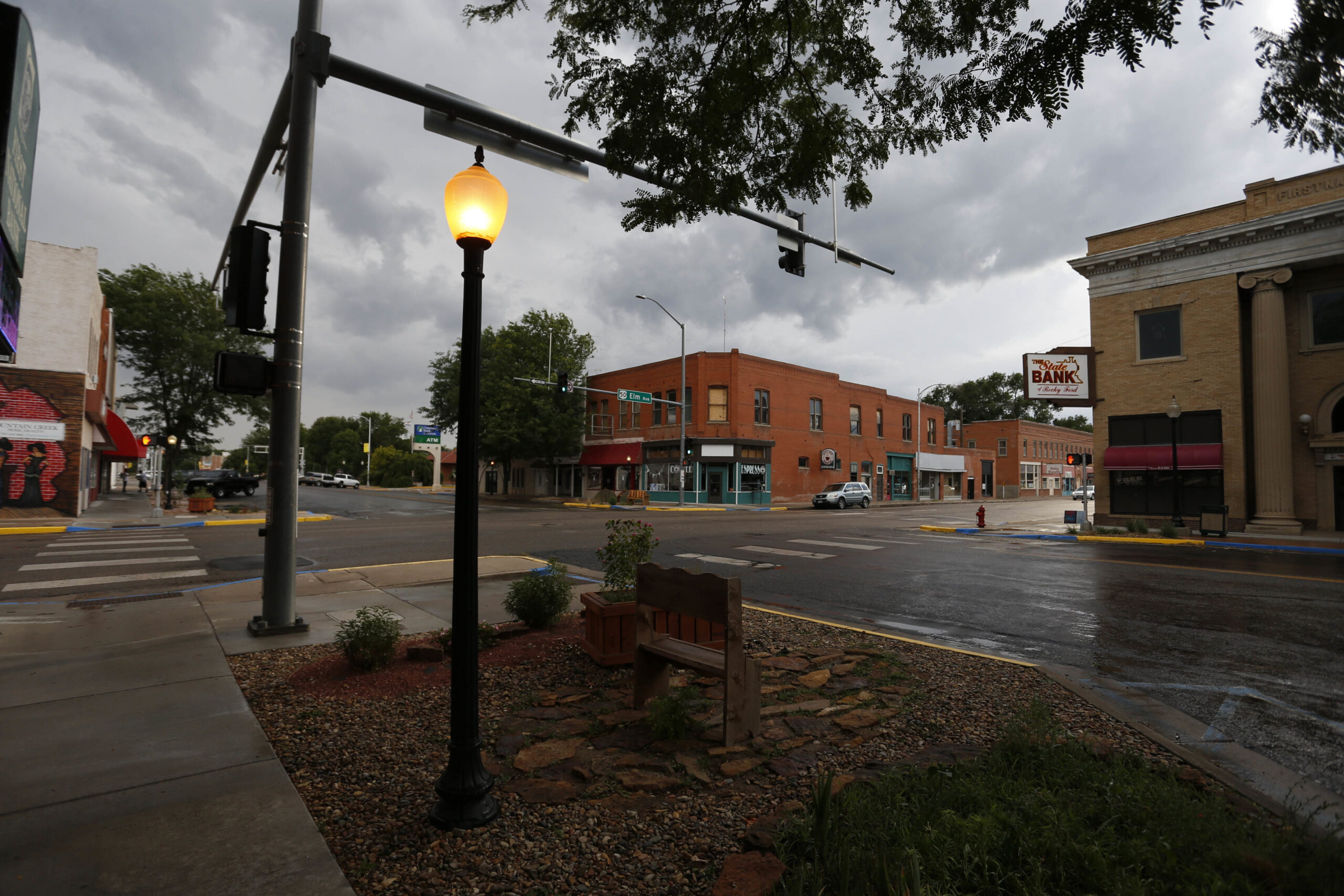 In this June 30, 2016 photo, street lamps light up as night approaches over Rocky Ford, Colo., in Otero County, a rural and increasingly impoverished part of southern Colorado. Rural areas have been especially slow to recover from the Great Recession that began in 2008: The most recent study by the U.S. Department of Agriculture found that, as of 2014, rural areas still had not regained all the jobs lost in the recession while metropolitan areas had. (AP Photo/Brennan Linsley) (AP)