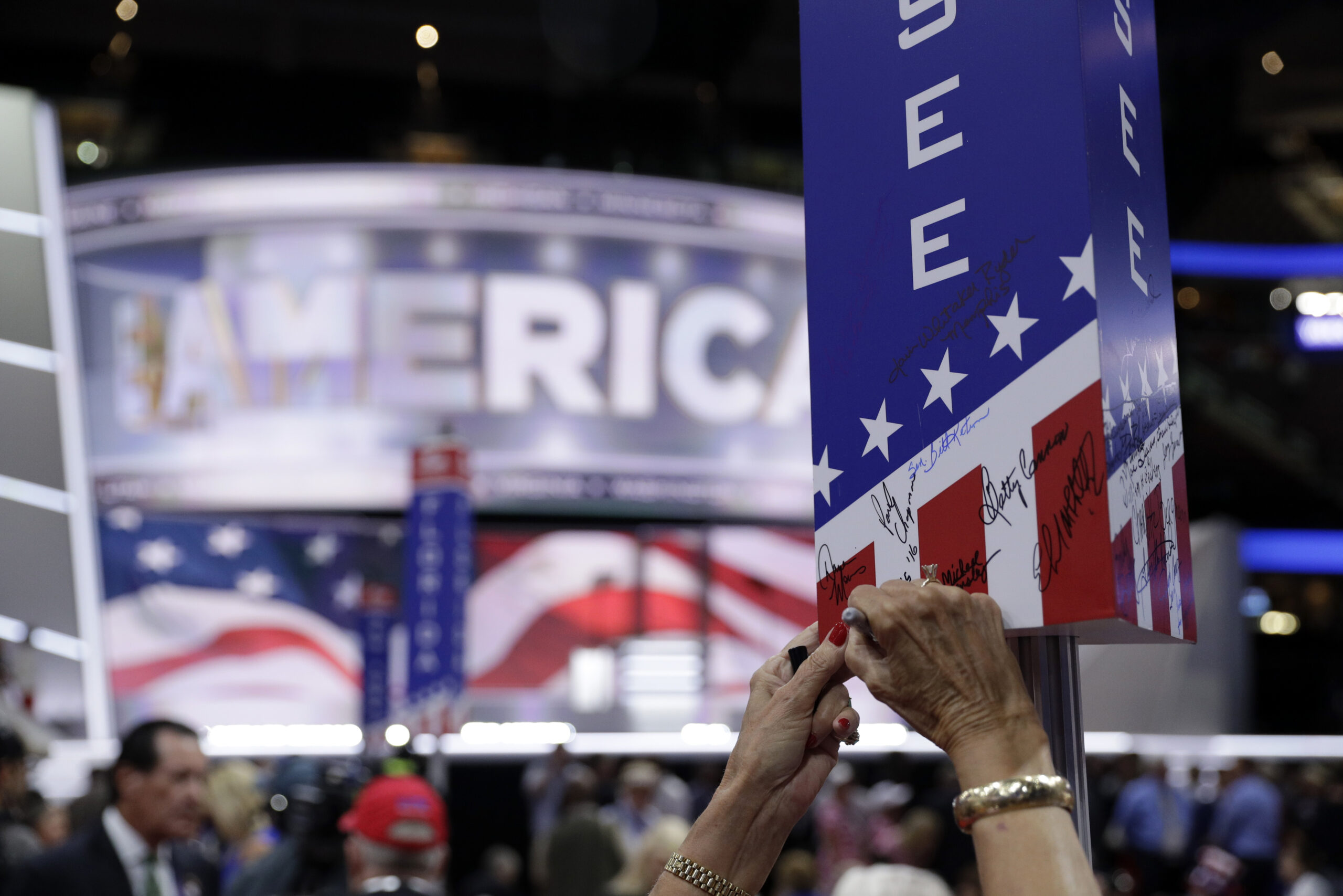 A Tennessee delegate signs on the post before the final day of the Republican National Convention in Cleveland, Thursday, July 21, 2016. (AP Photo/John Locher) (AP)
