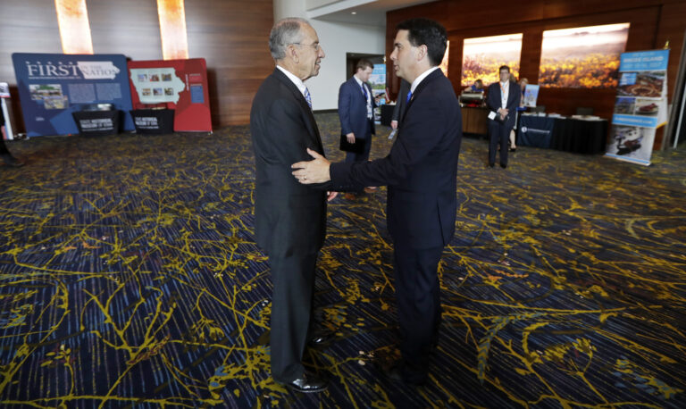 U.S. Sen. Chuck Grassley, R-Iowa, talks with Wisconsin Gov. Scott Walker, right, during the National Governors Association meeting, Friday, July 15, 2016, in Des Moines, Iowa. (AP)