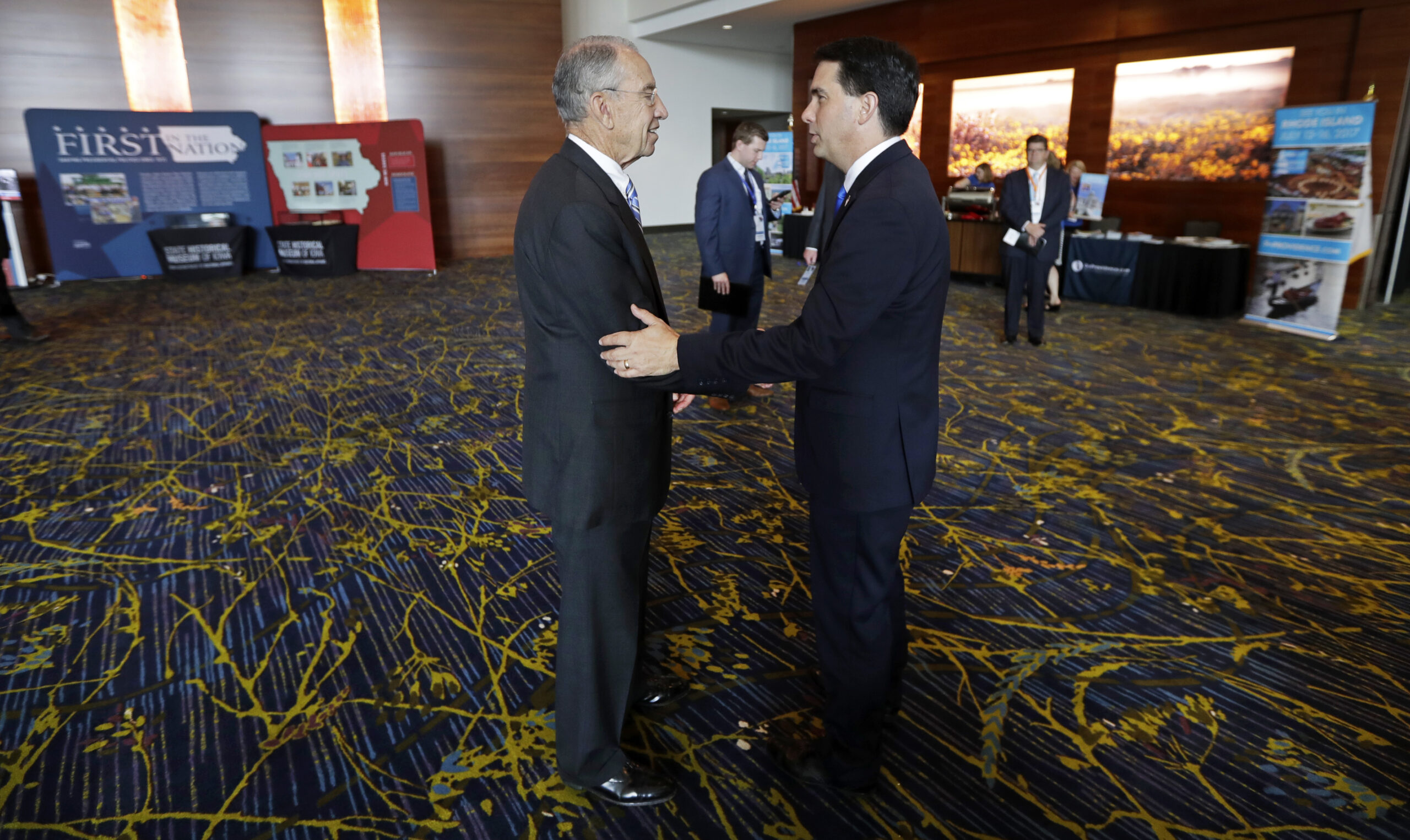 U.S. Sen. Chuck Grassley, R-Iowa, talks with Wisconsin Gov. Scott Walker, right, during the National Governors Association meeting, Friday, July 15, 2016, in Des Moines, Iowa. (AP)