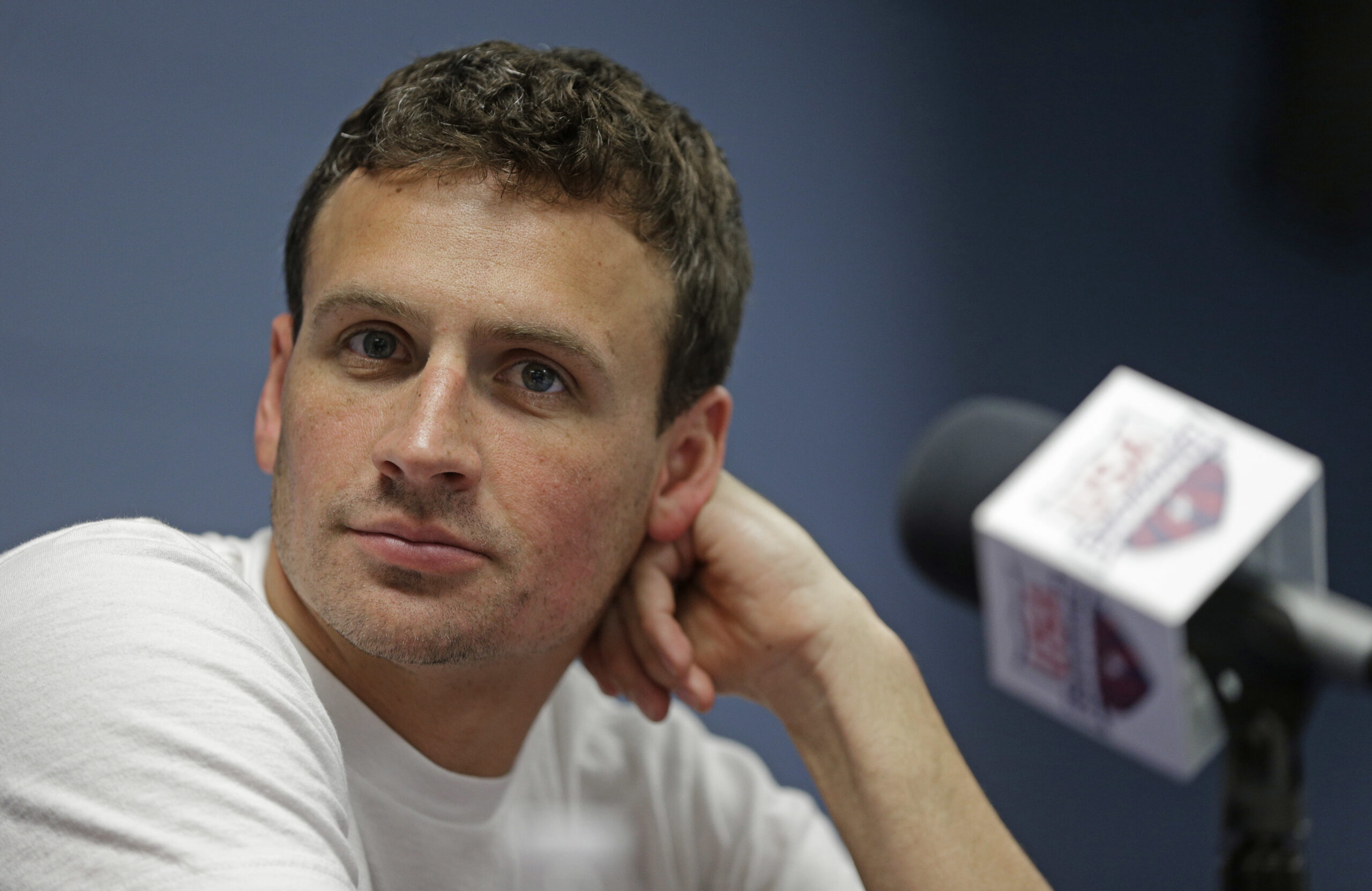 FILE - In this May 12, 2016, file photo, Ryan Lochte listens to a question from the media in Charlotte, N.C. Missy Franklin and Ryan Lochte will be busy in the pool at the Rio Olympics. Just not as busy as they wanted to be. The two popular stars from the U.S. swimming team four years ago in London have just three individual events between them in Rio, hardly the frenetic schedule they've grown accustomed to over the years. (AP Photo/Chuck Burton, File) (AP)
