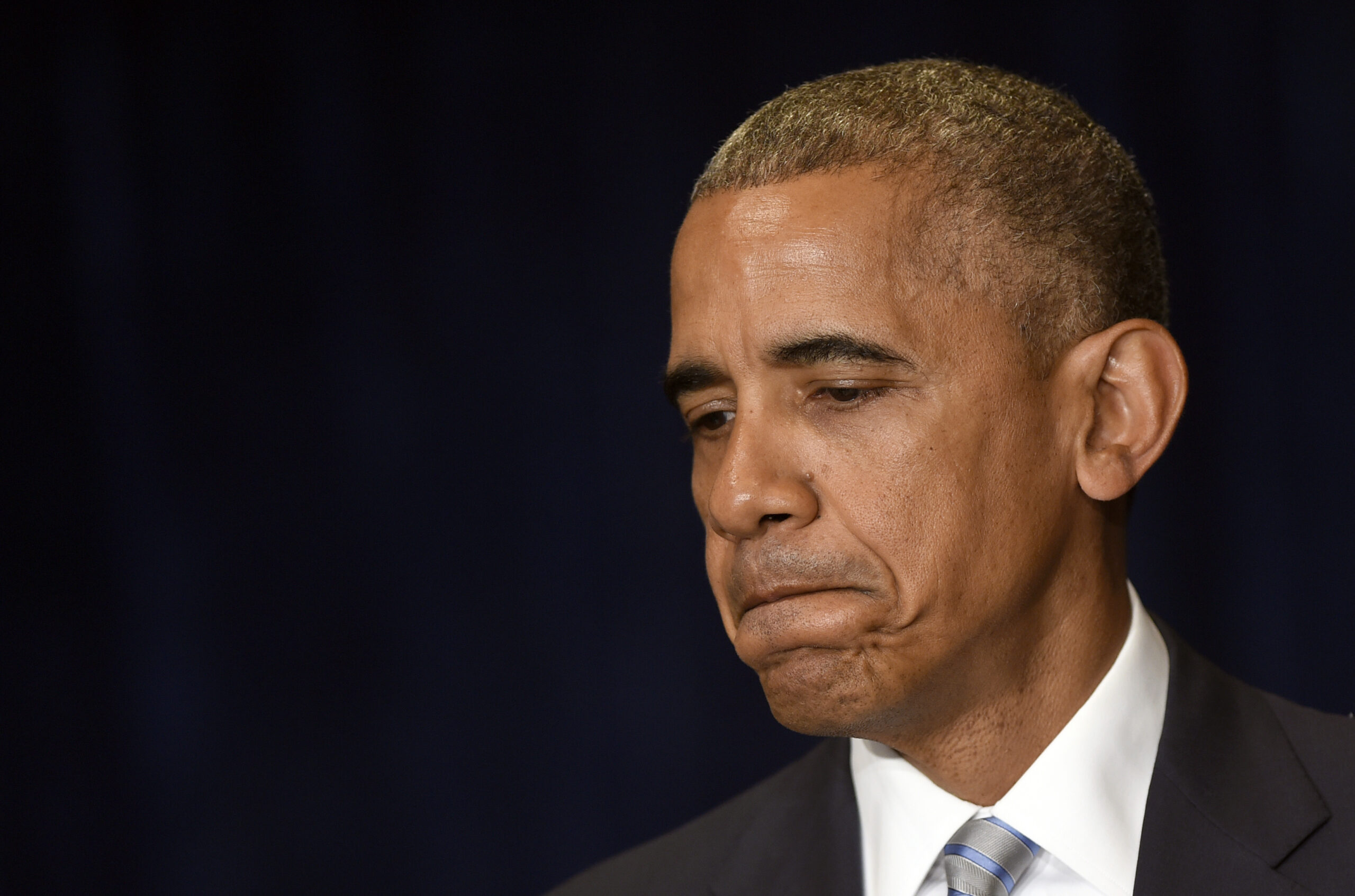 President Barack Obama pauses as he makes a statement on the fatal police shootings of two black men in Louisiana and Minnesota after arriving in Warsaw, Poland, Friday, July 8, 2016. (AP Photo/Susan Walsh)